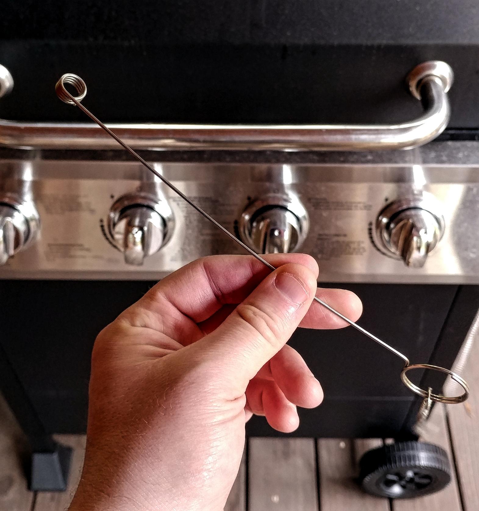 Strange wire tool that came with my DynaGlo grill. It's attached by a