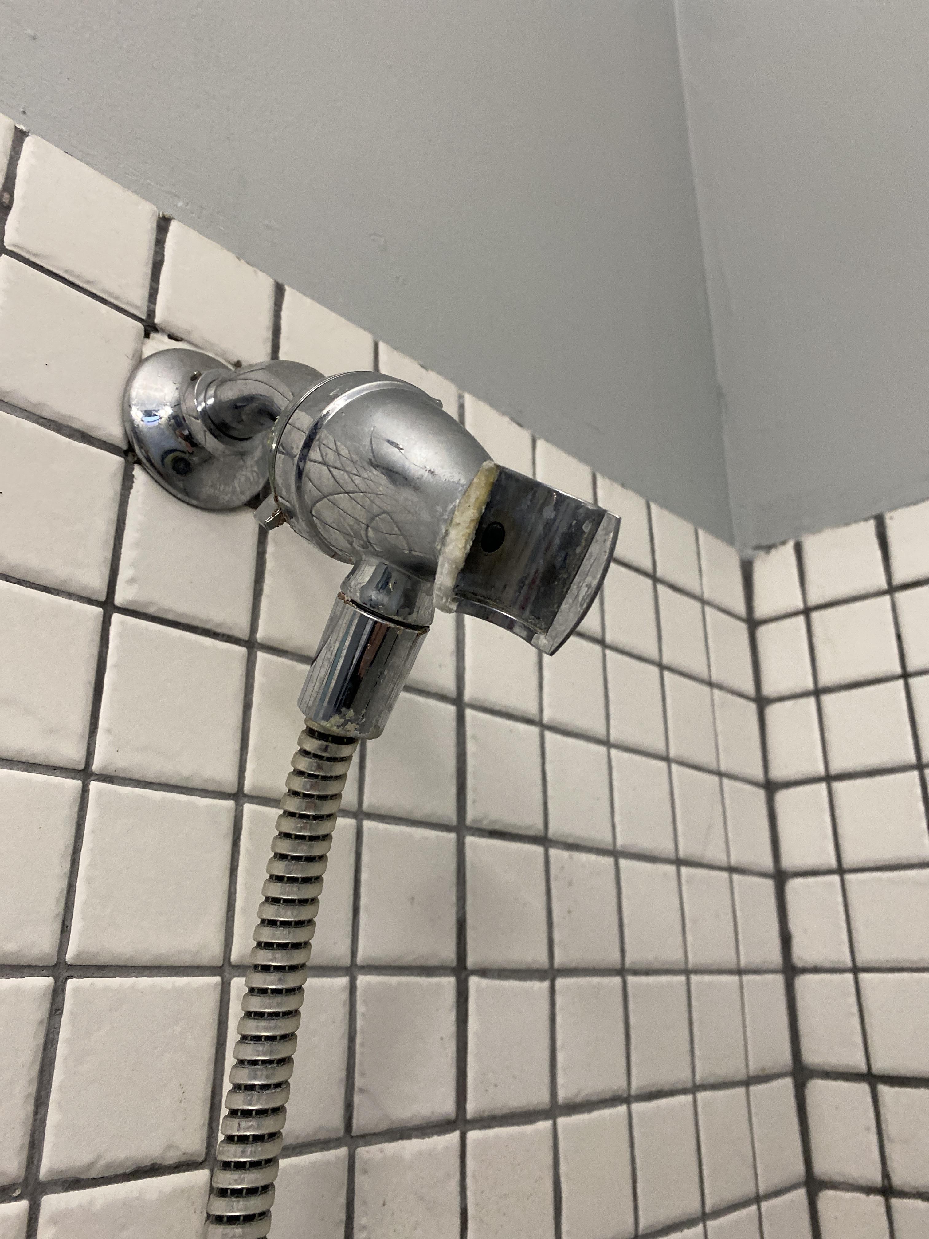 need help, how do i fix this? part of the shower head holder (not too