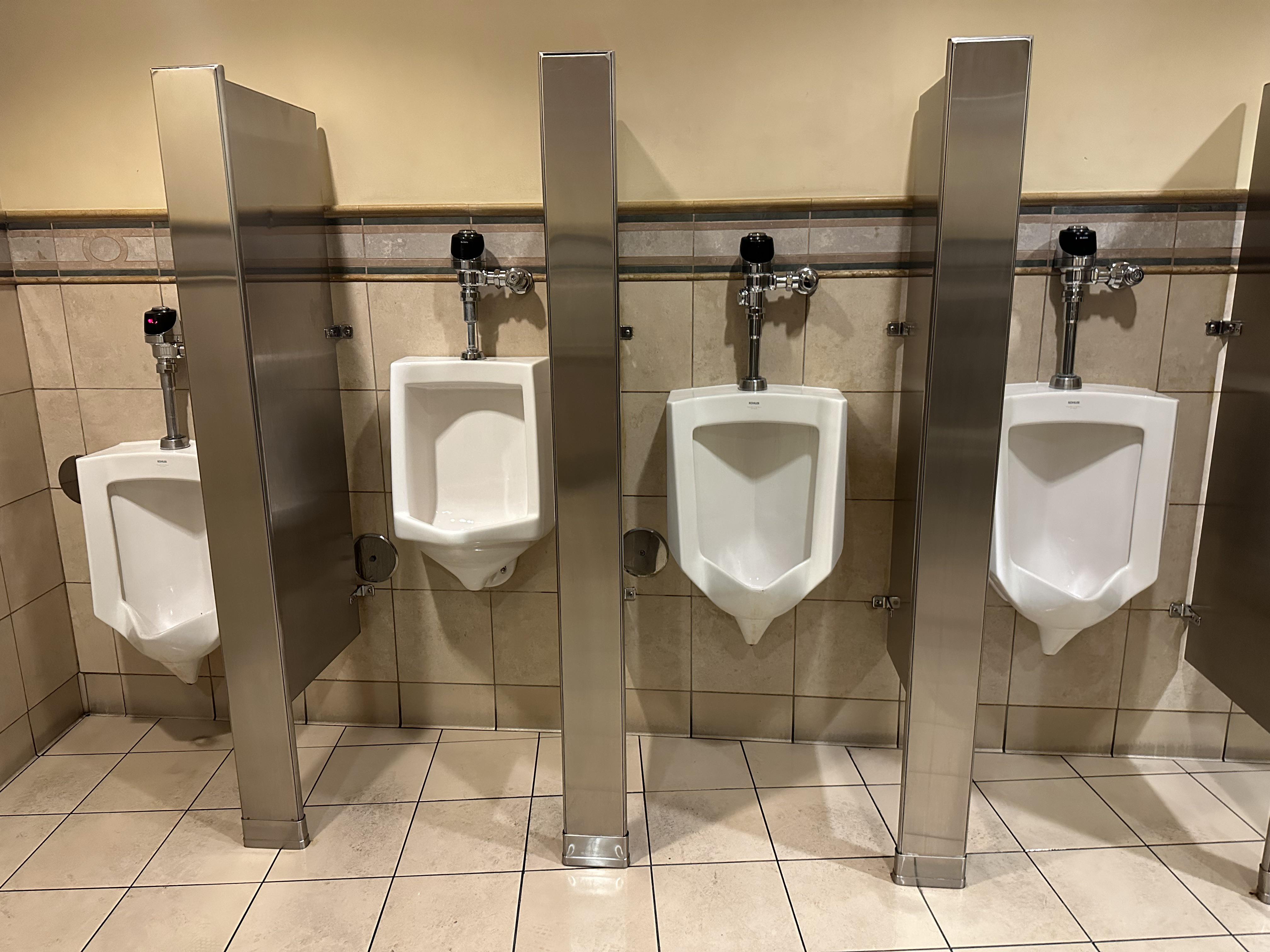 Second urinal on the left is higher than the standard height ones r
