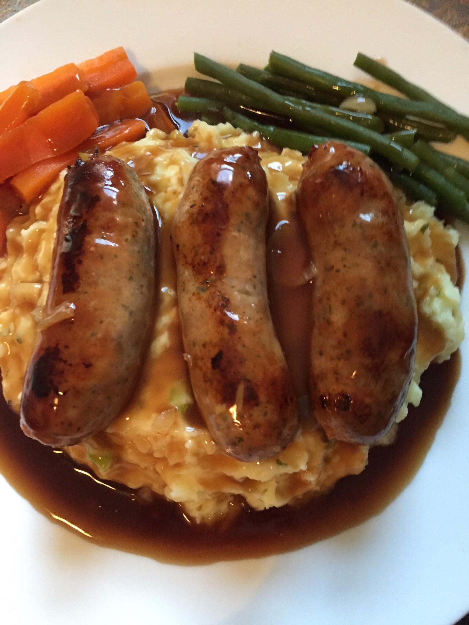 Bangers and herb mash with onion gravy r/UK_Food