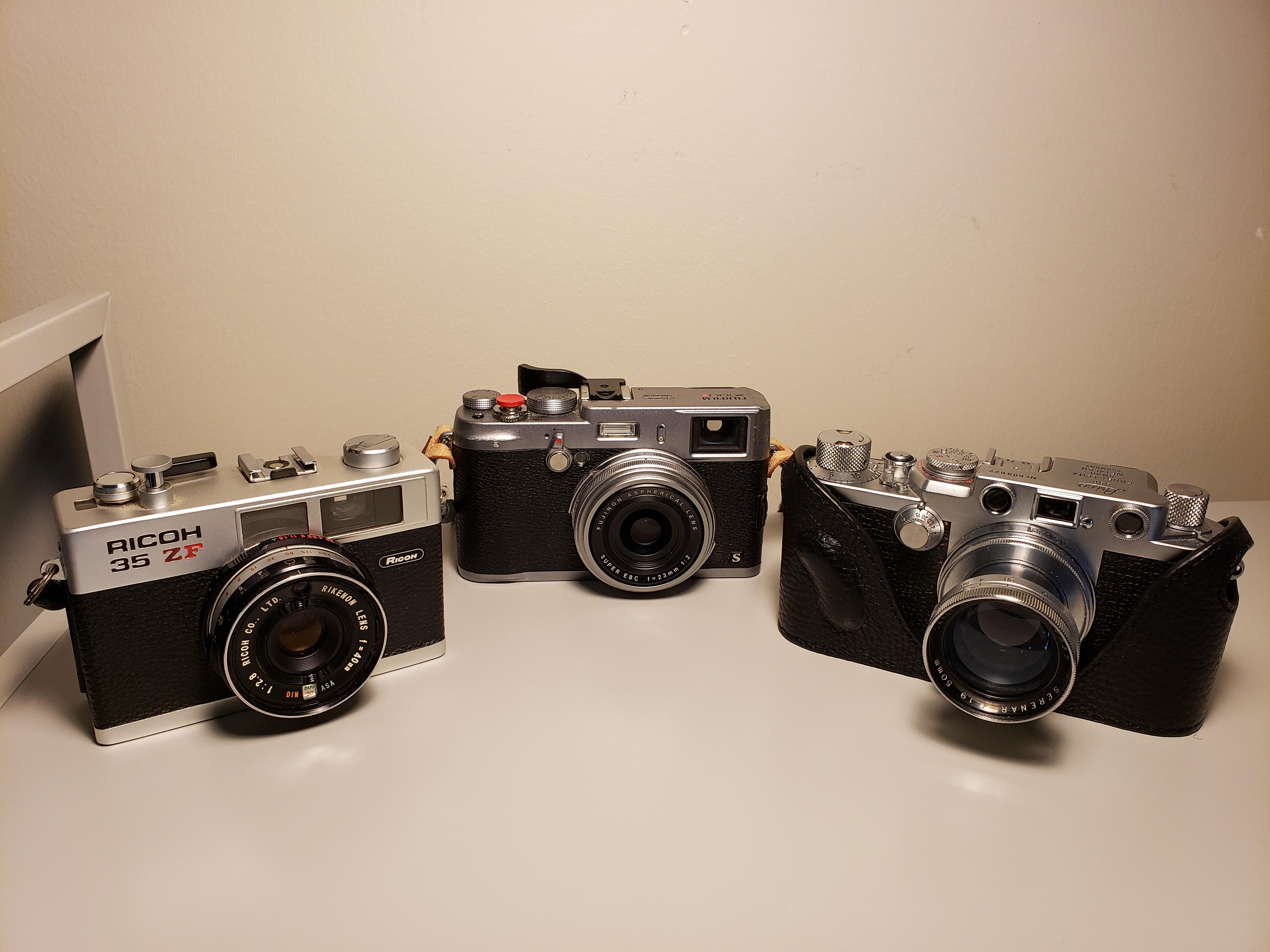 My small rangefinder(ish) collection (Leica IIIF, Ricoh 35 ZF, and