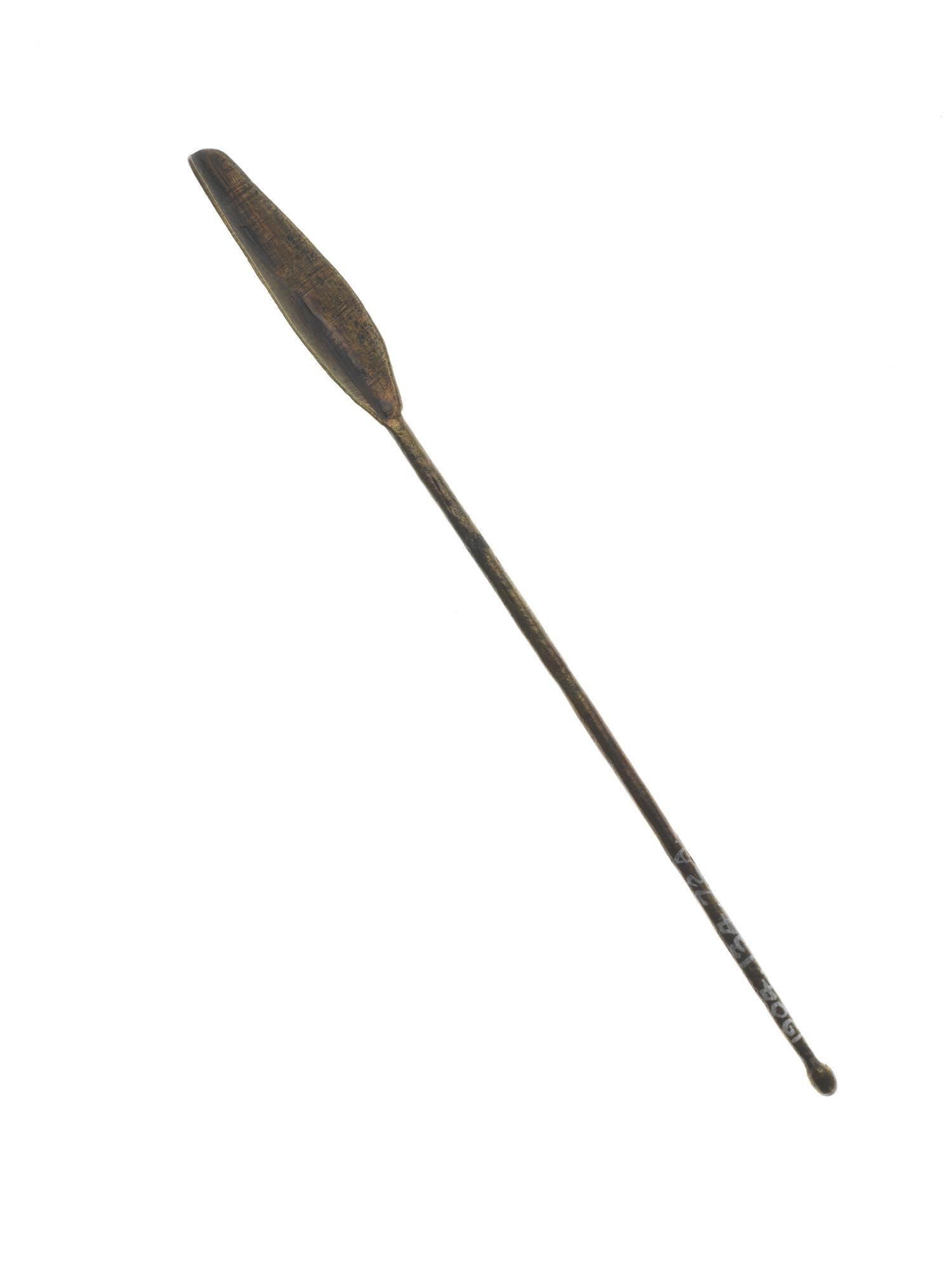Toilet spoon in bronze with a long rod handle and a long leafshaped