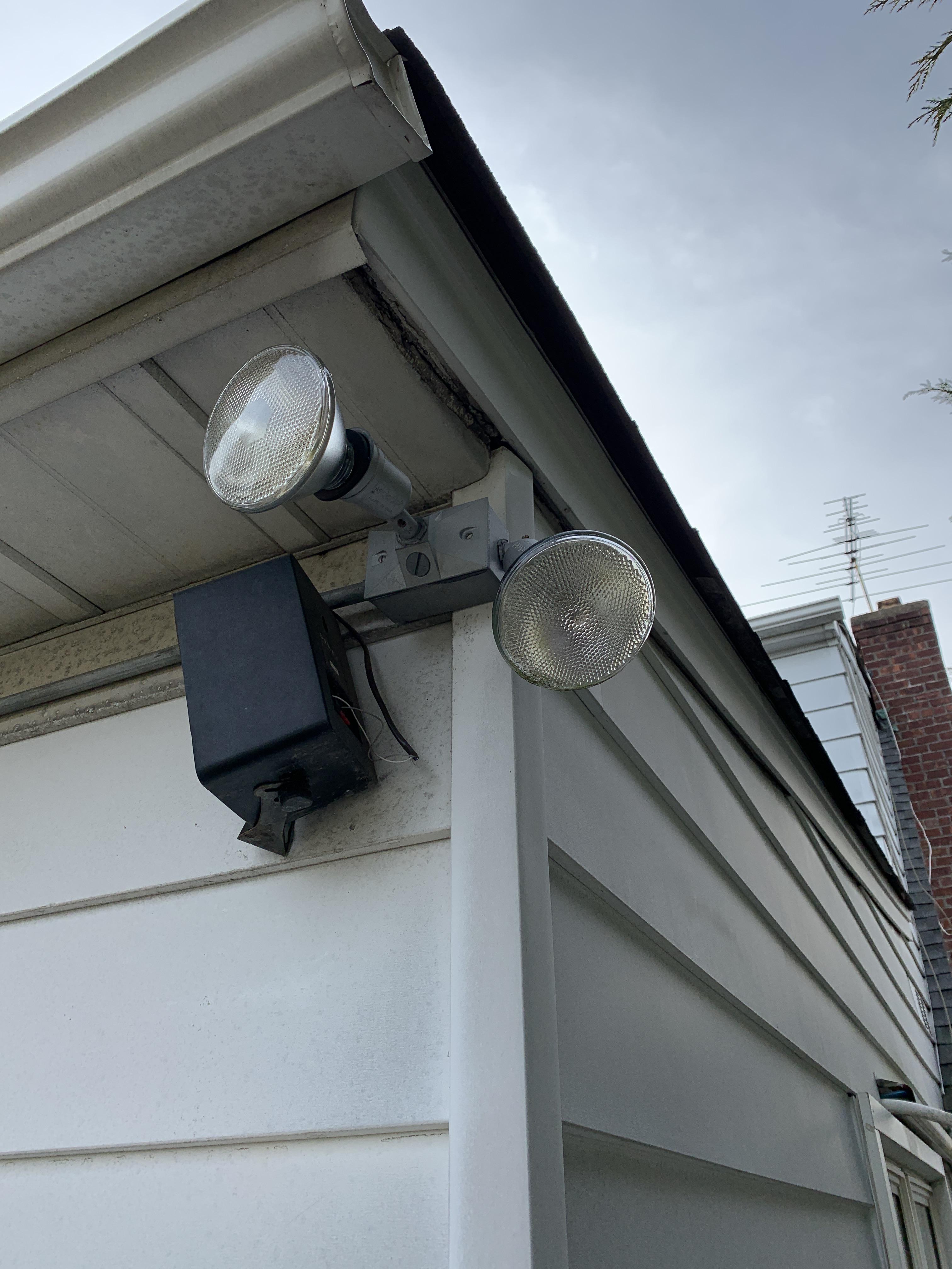 Can I mount a flood light cam to this box? Does someone know what piece