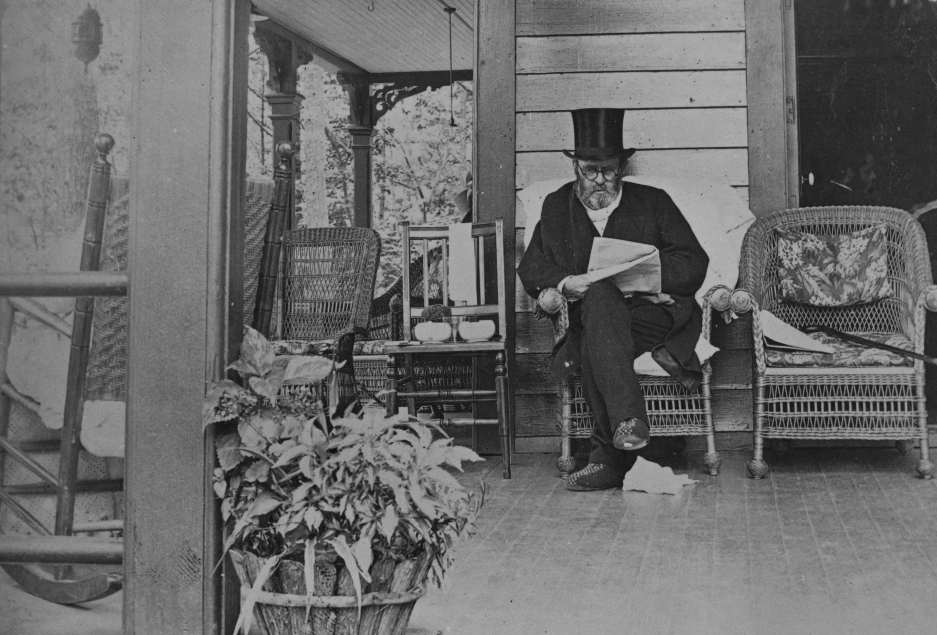 final photo of 18th US President Ulysses S. Grant reading a newspaper