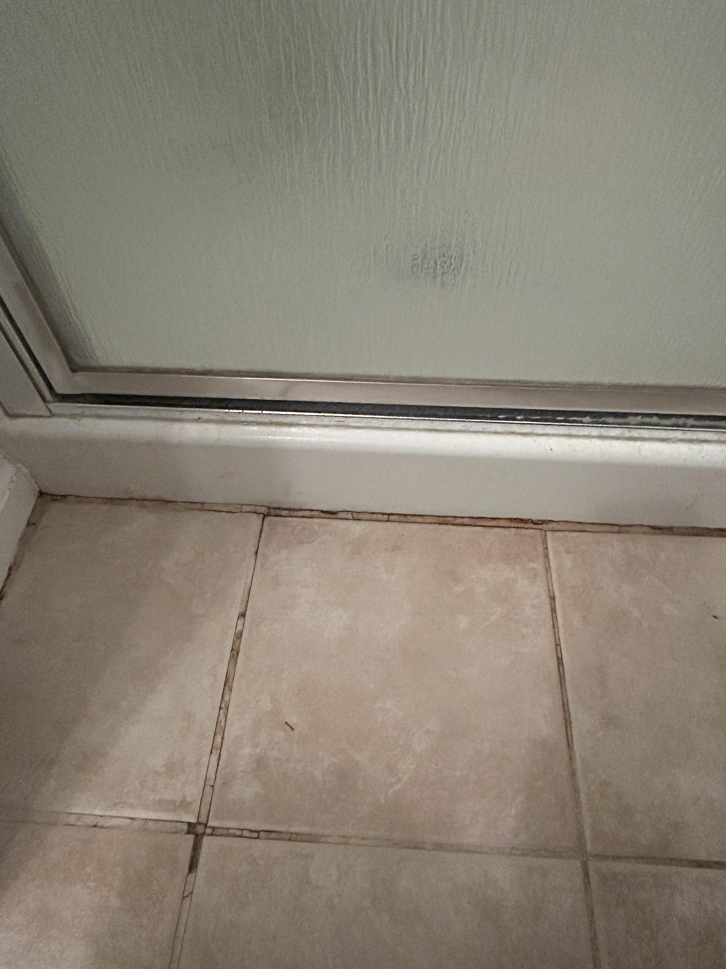 Water under tiles r/bathrooms