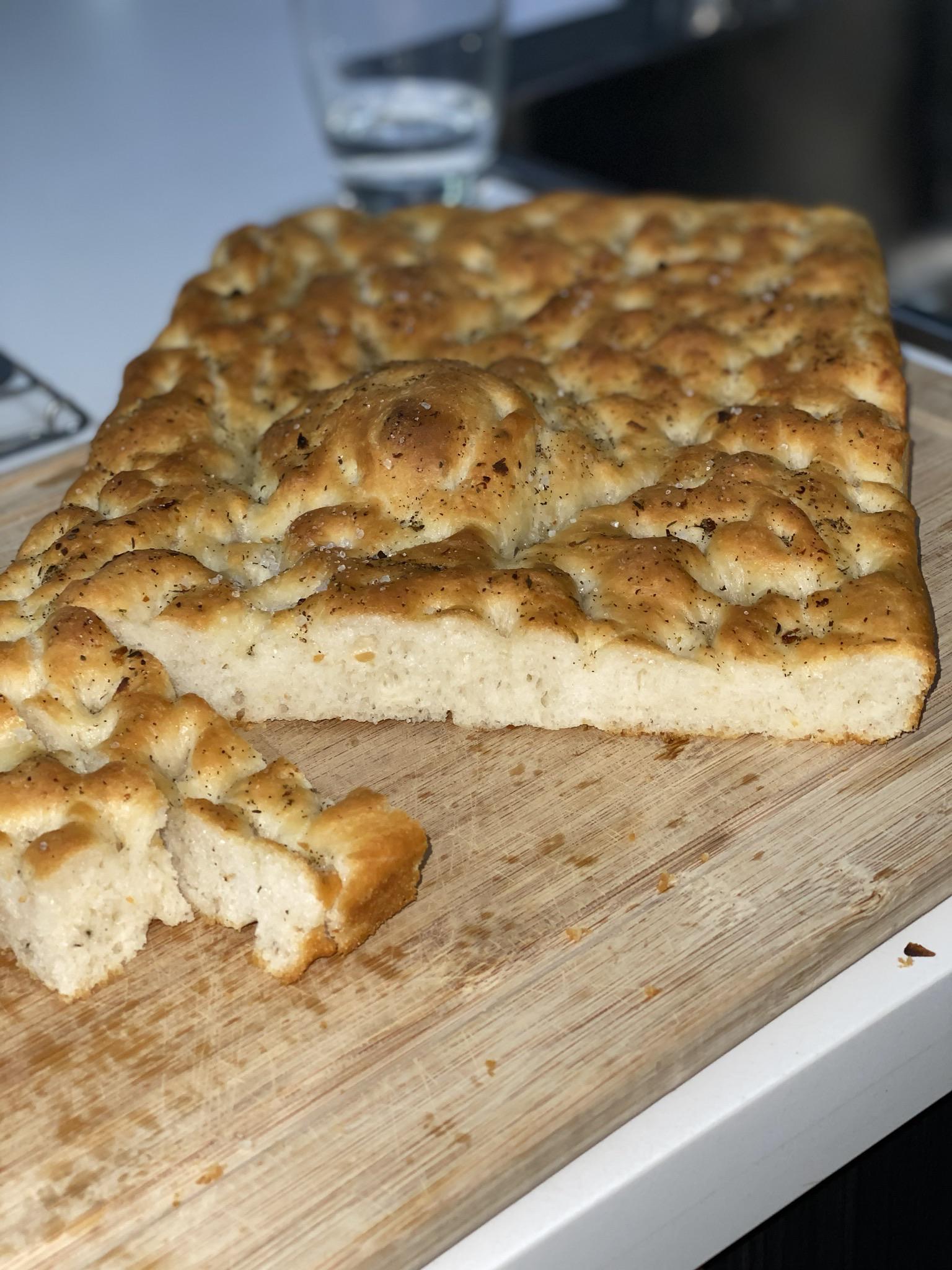 My first focaccia! Roasted garlic with rosemary/sage/thyme blend. r