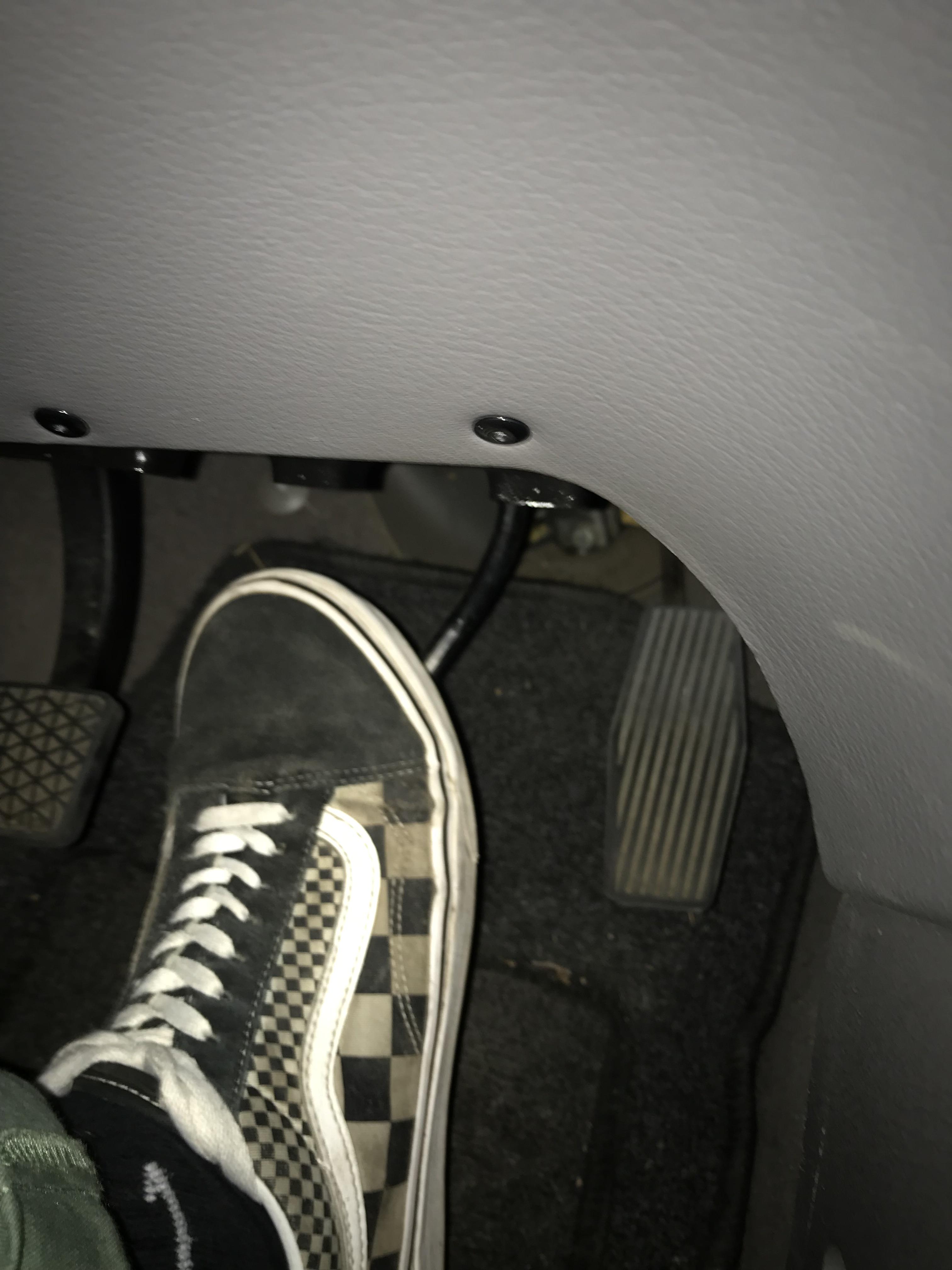 How can I heeltoe downshift in my car when the gas pedal is pushed backwards? My heel can’t