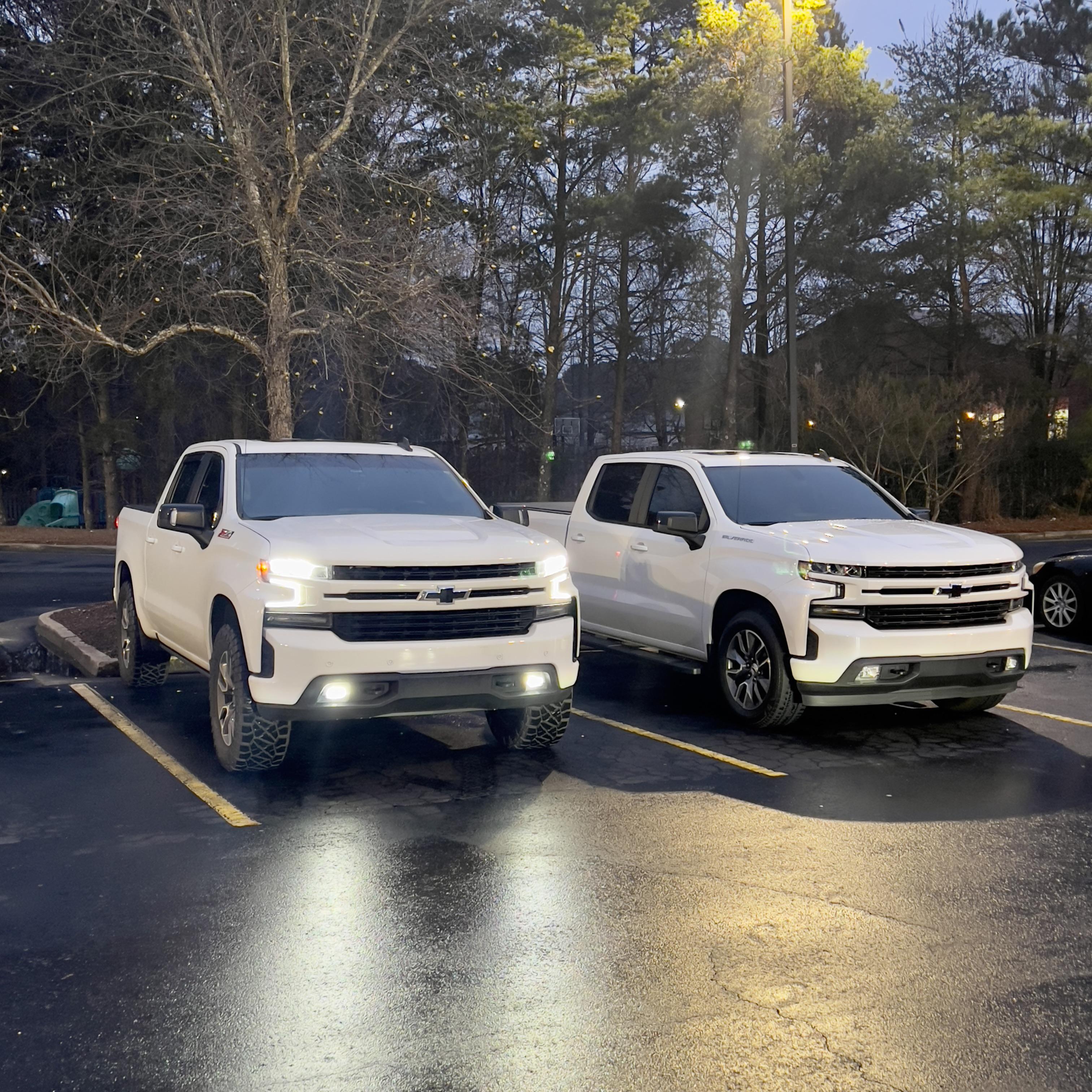 My RST Z71 leveled on 35x12.50s next to a stock RST. Best looking