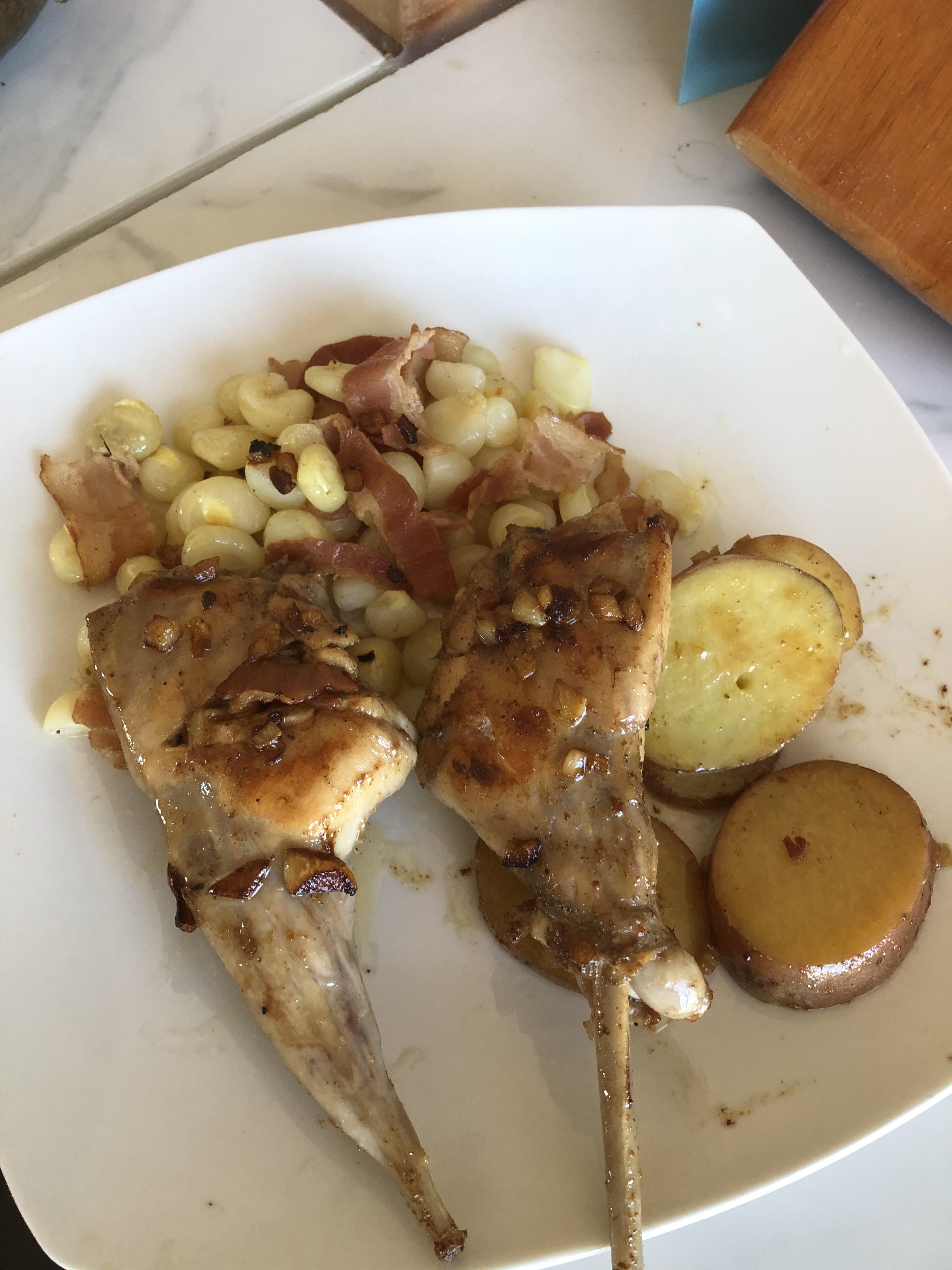 Pan seared rabbit with bacon fat cooked corn and pan seared potatoes