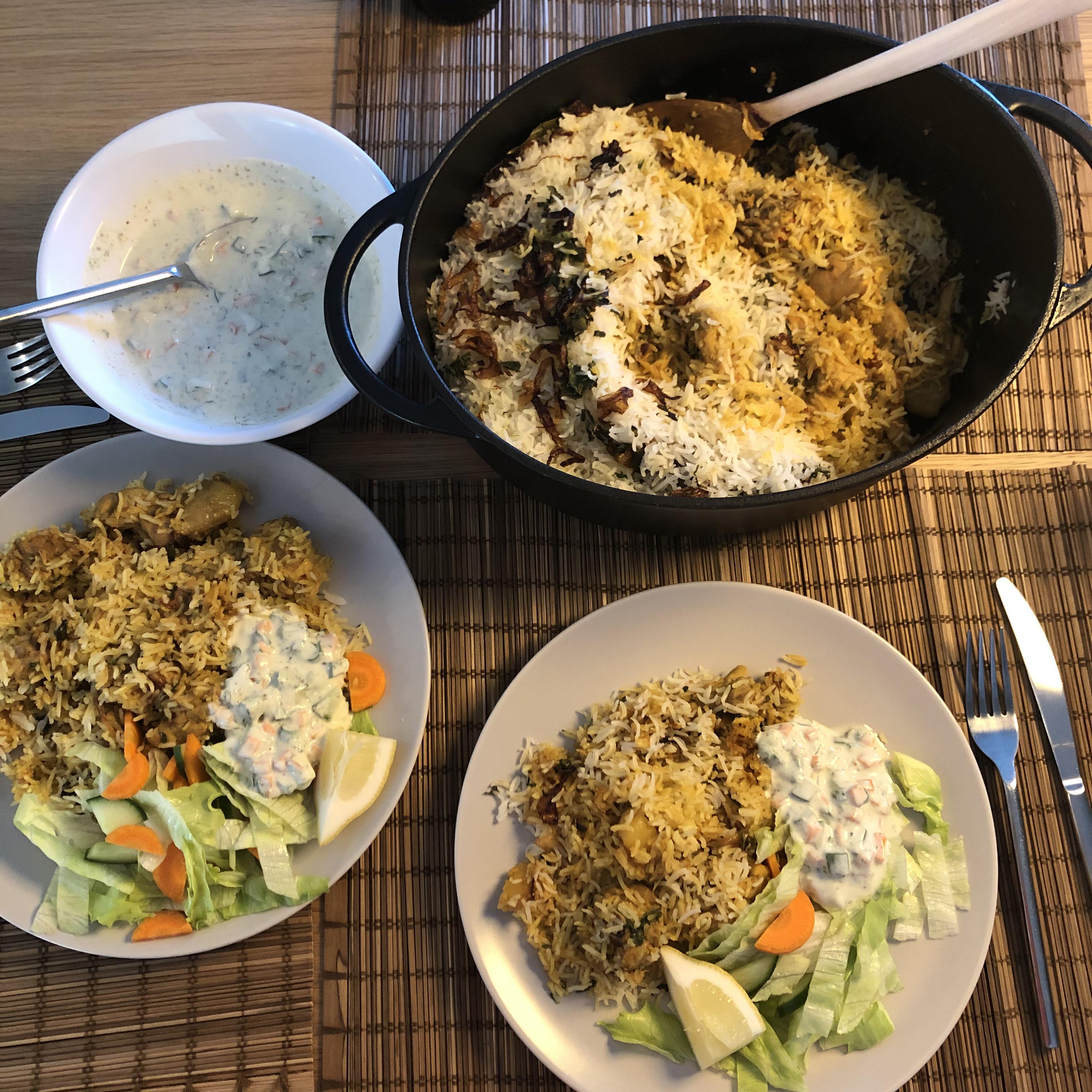 Homemade chicken dum Biryani (using a Dutch oven) with fresh salad and