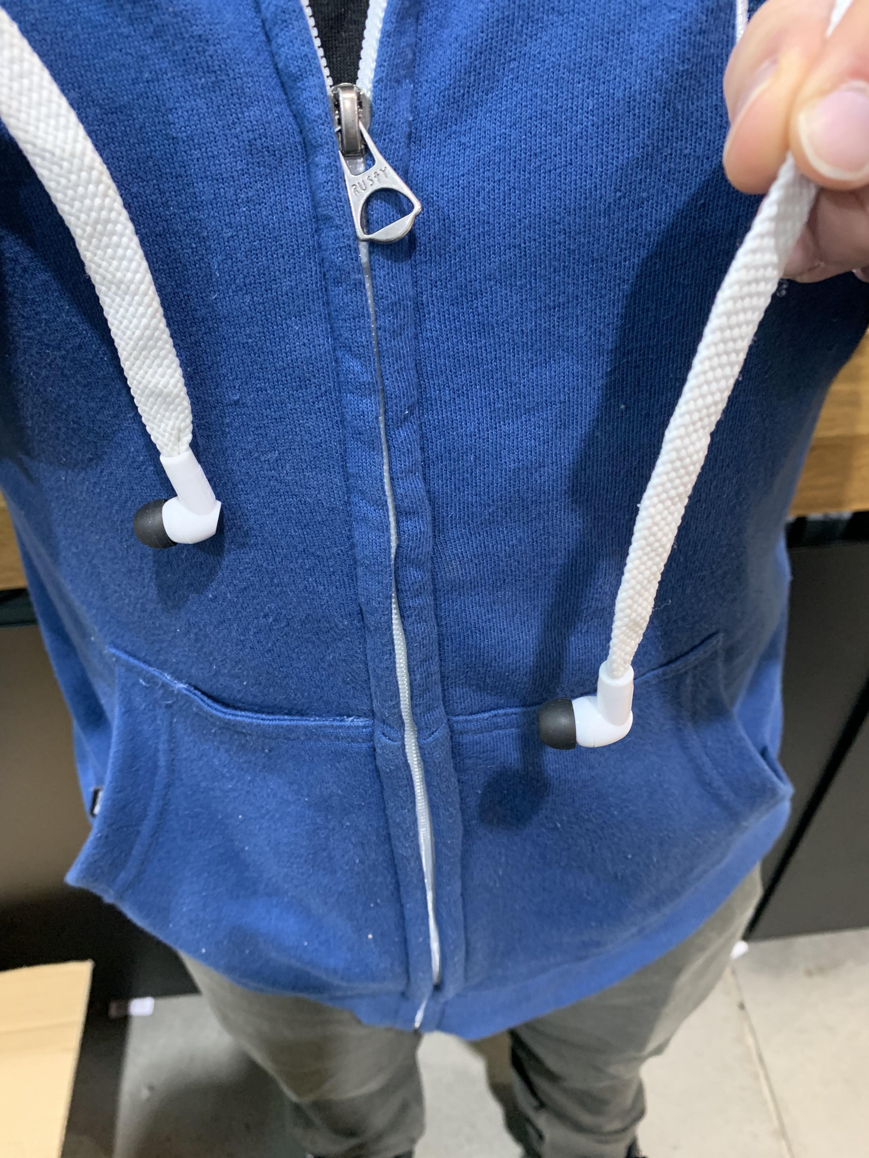 My coworker’s hoodie has headphones threaded through the drawstring