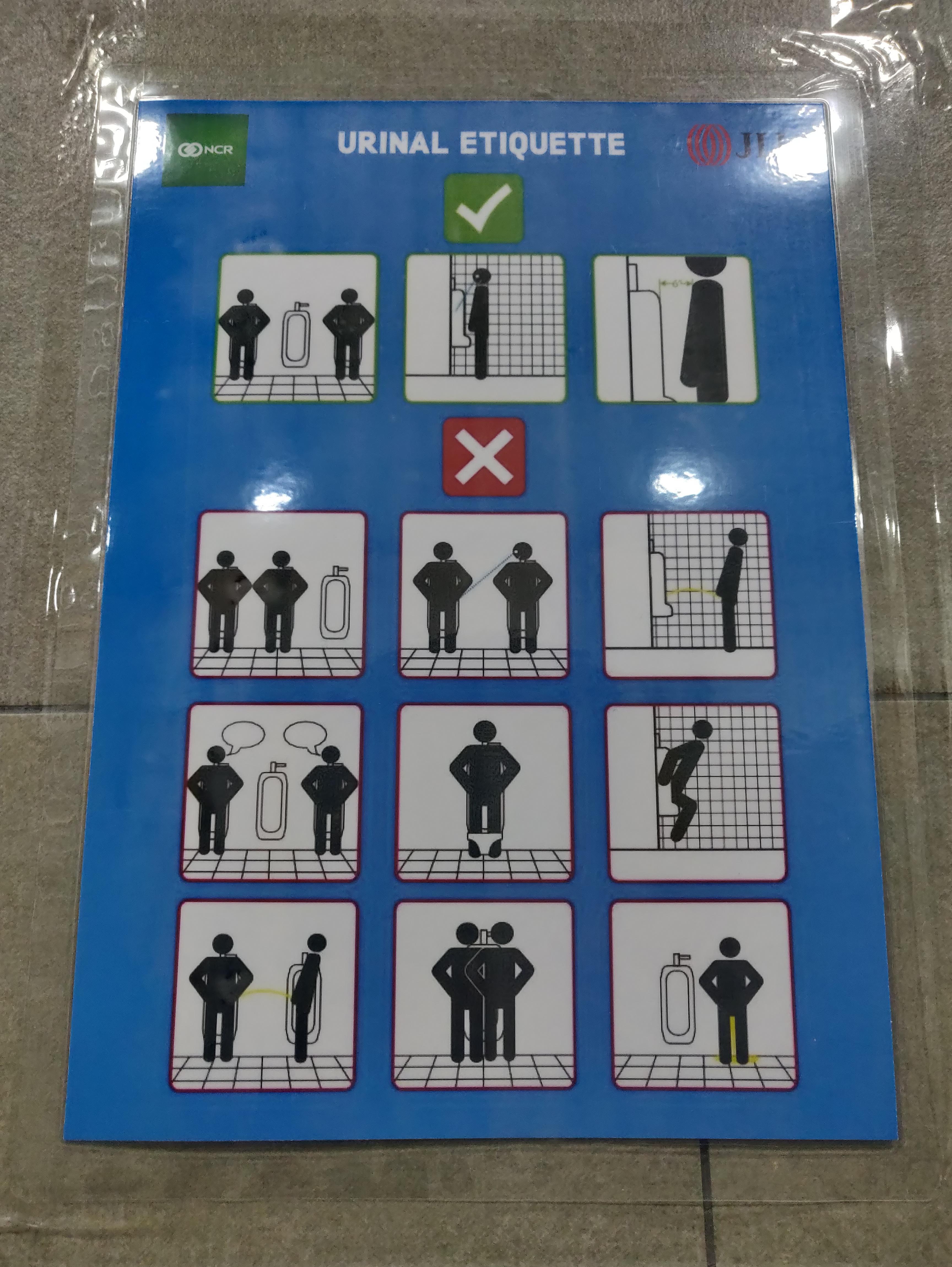 A poster teaching people urinal etiquette. We need this in every men's