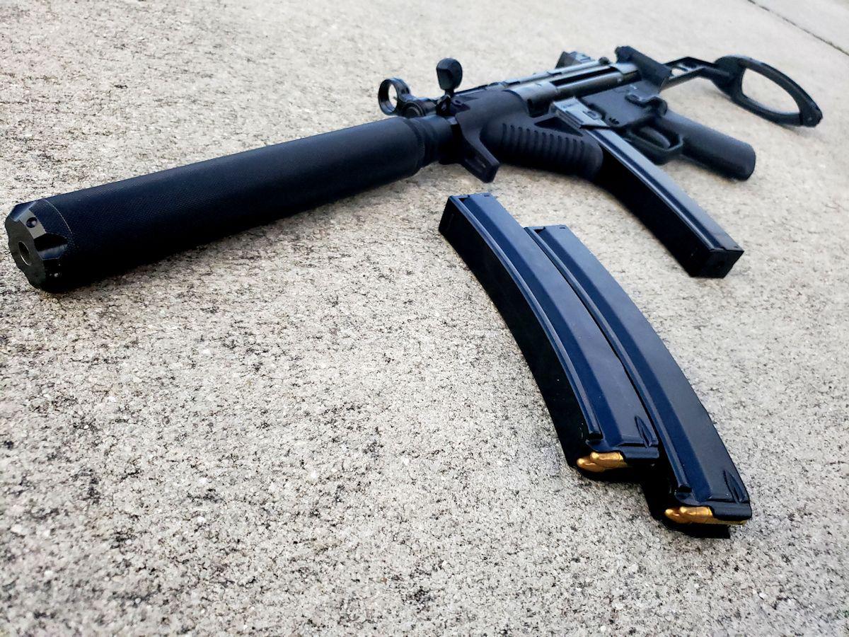 Omega pistol with Form 1 can. r/MP5