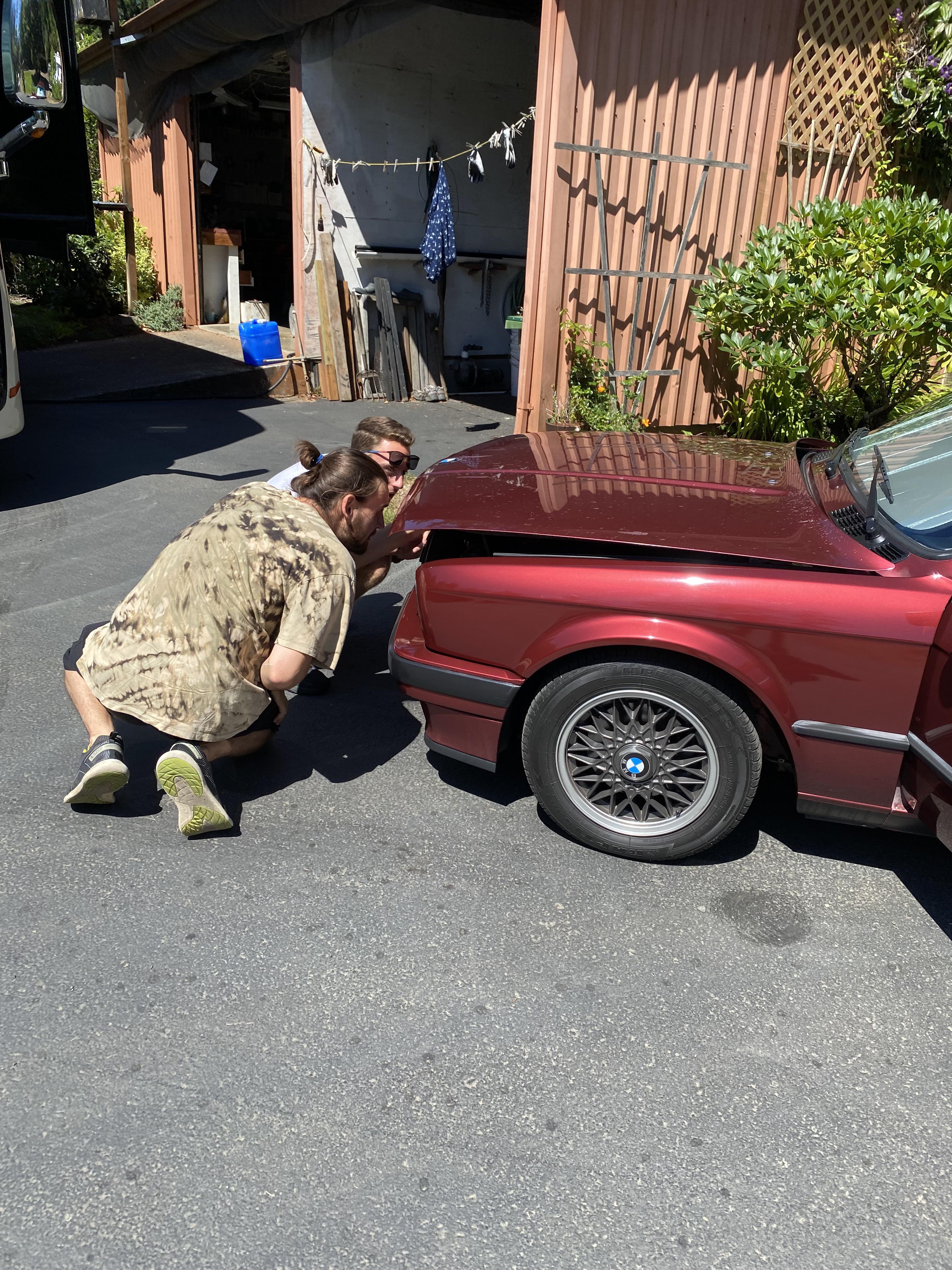 My cousins trying to find the hood latch ) r/E30