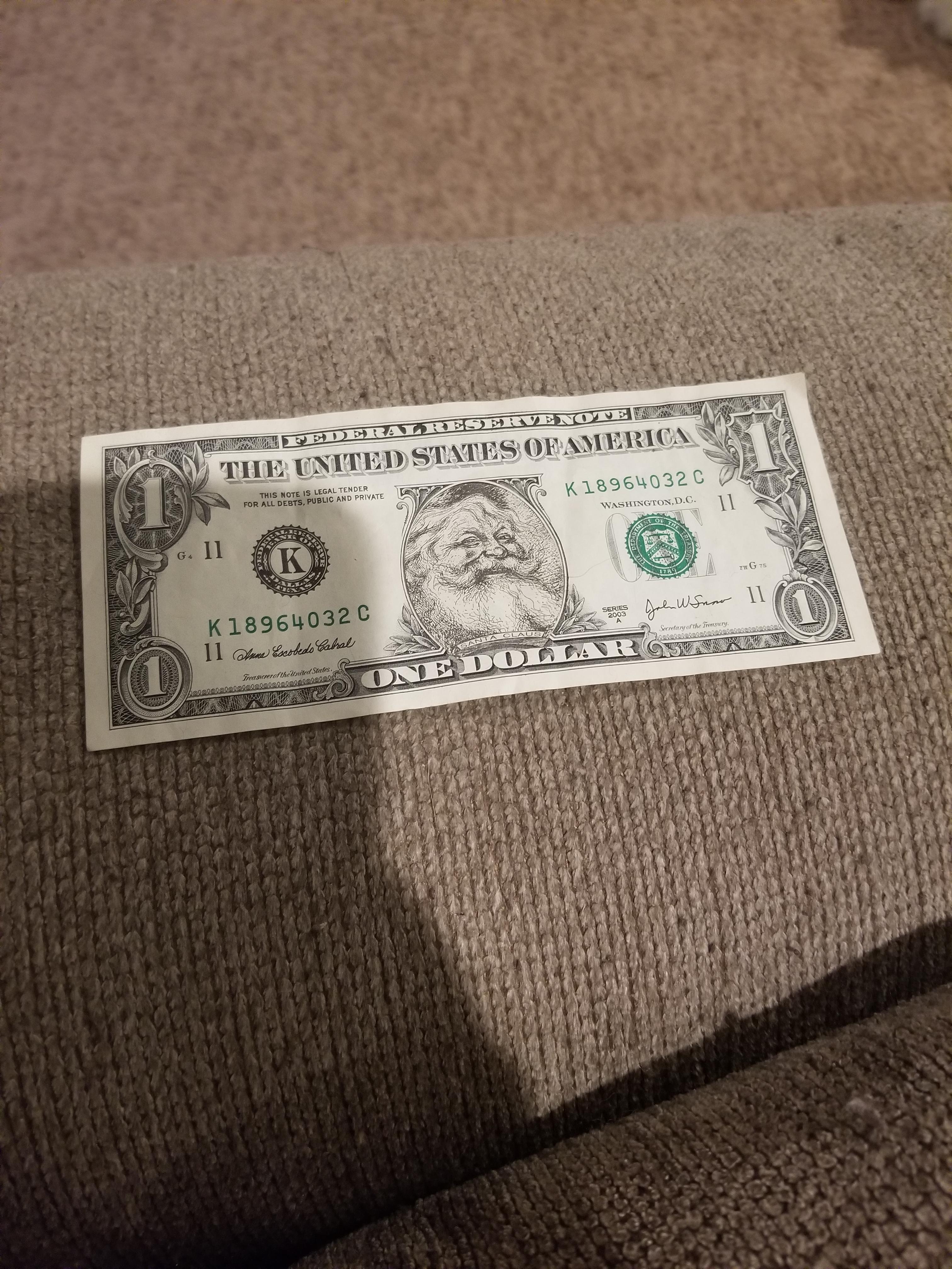 Found this old Santa Dollar from my grandmother r/mildlyinteresting