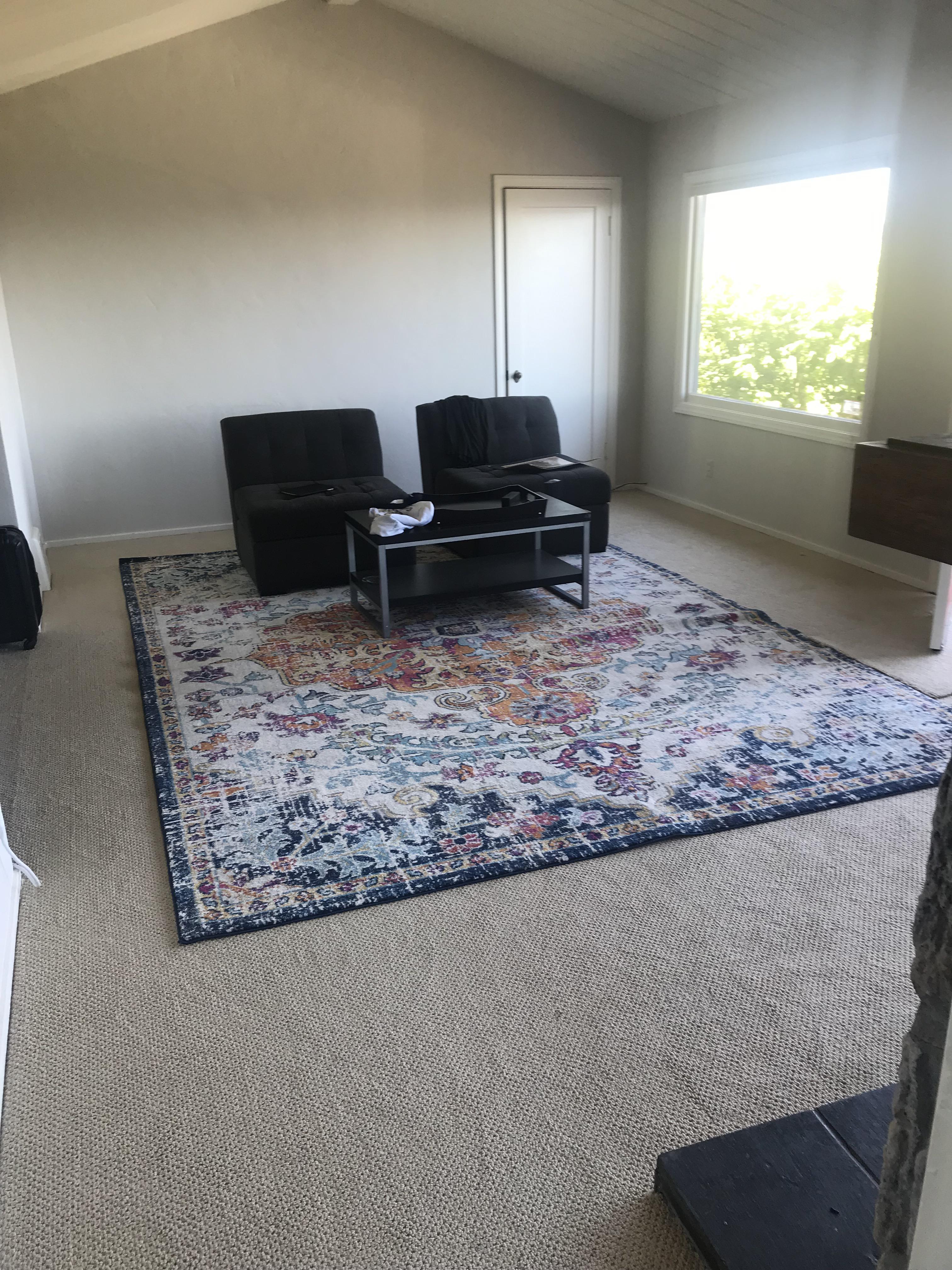 Advice needed! Is this area rug too big for this space? Will be getting