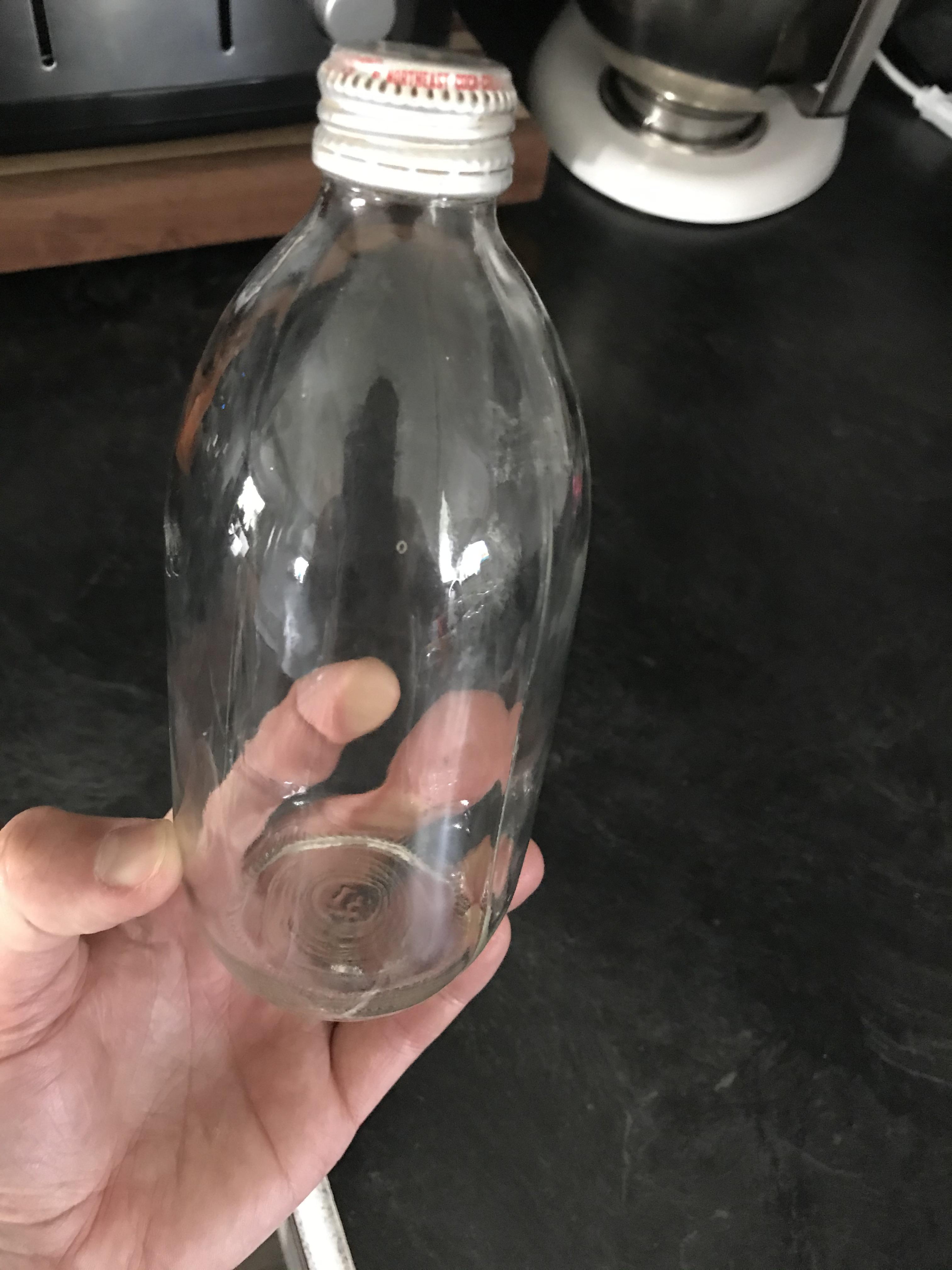 Question Can anyone date this bottle? On the cap it says “bottled under