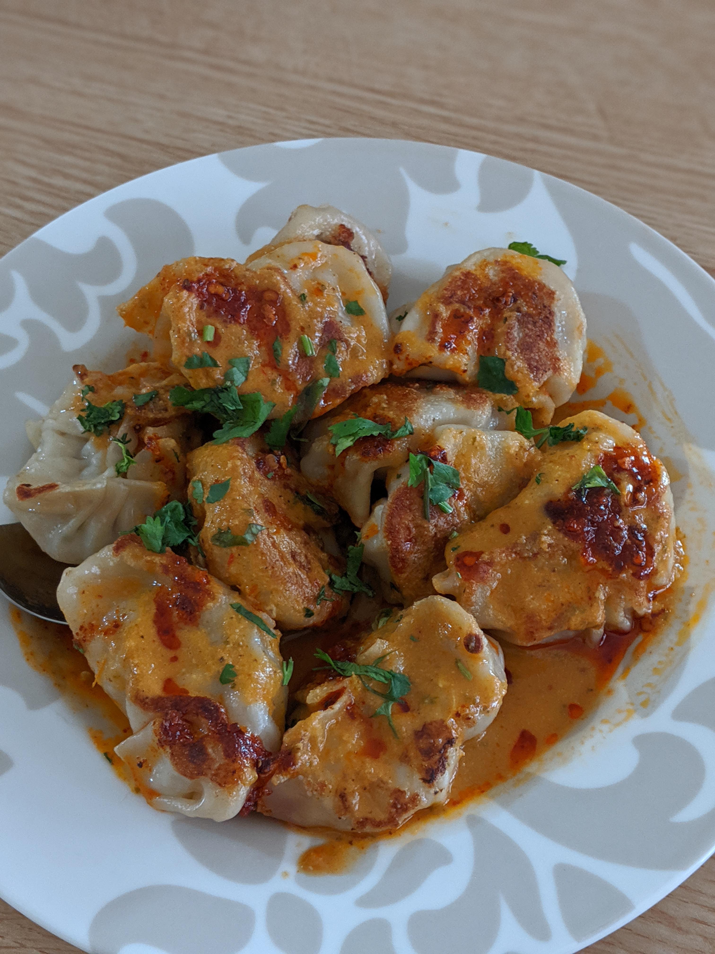 [homemade] dumplings with tomato sauce and chili oil. r/FoodPorn