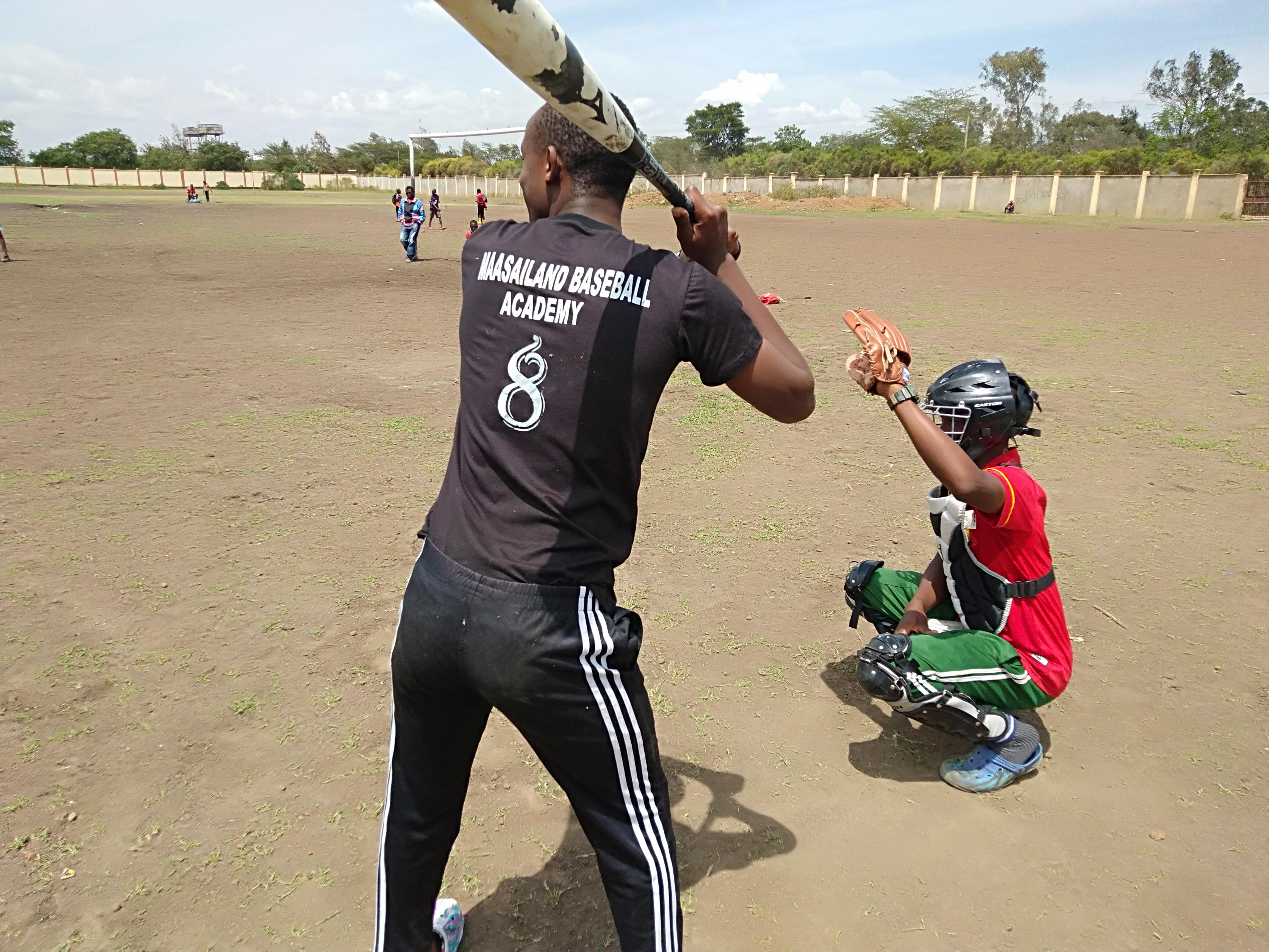 Photo of a batter taking an atbat at the Massailand Baseball Academy