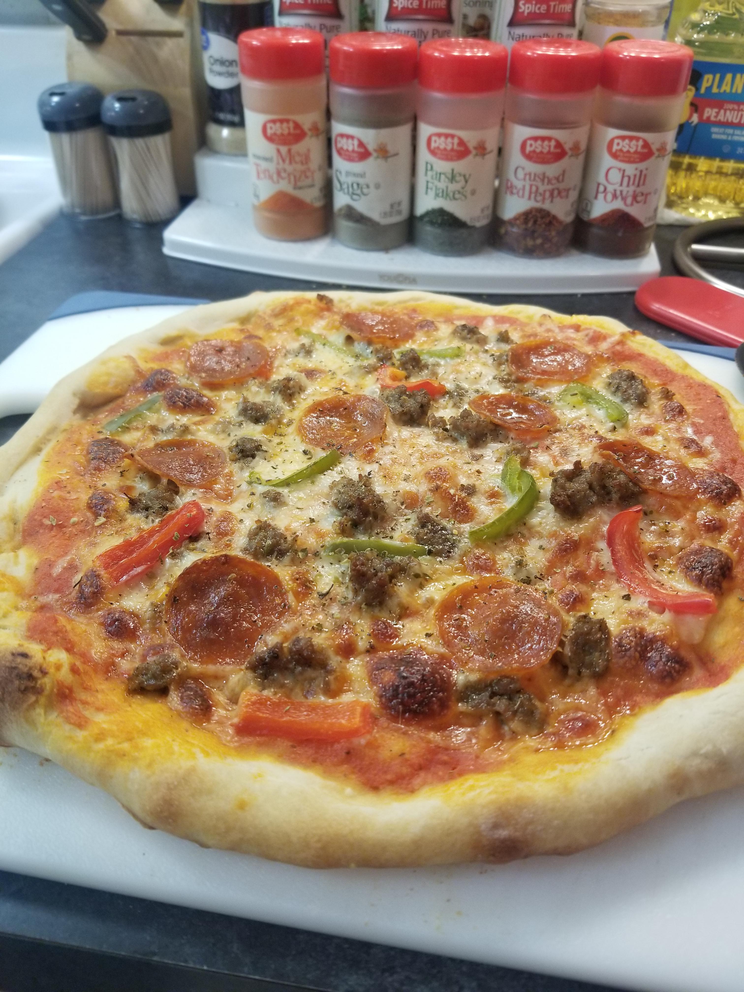 Homemade pepperoni, sausage, and bell pepper I made for a pizza night