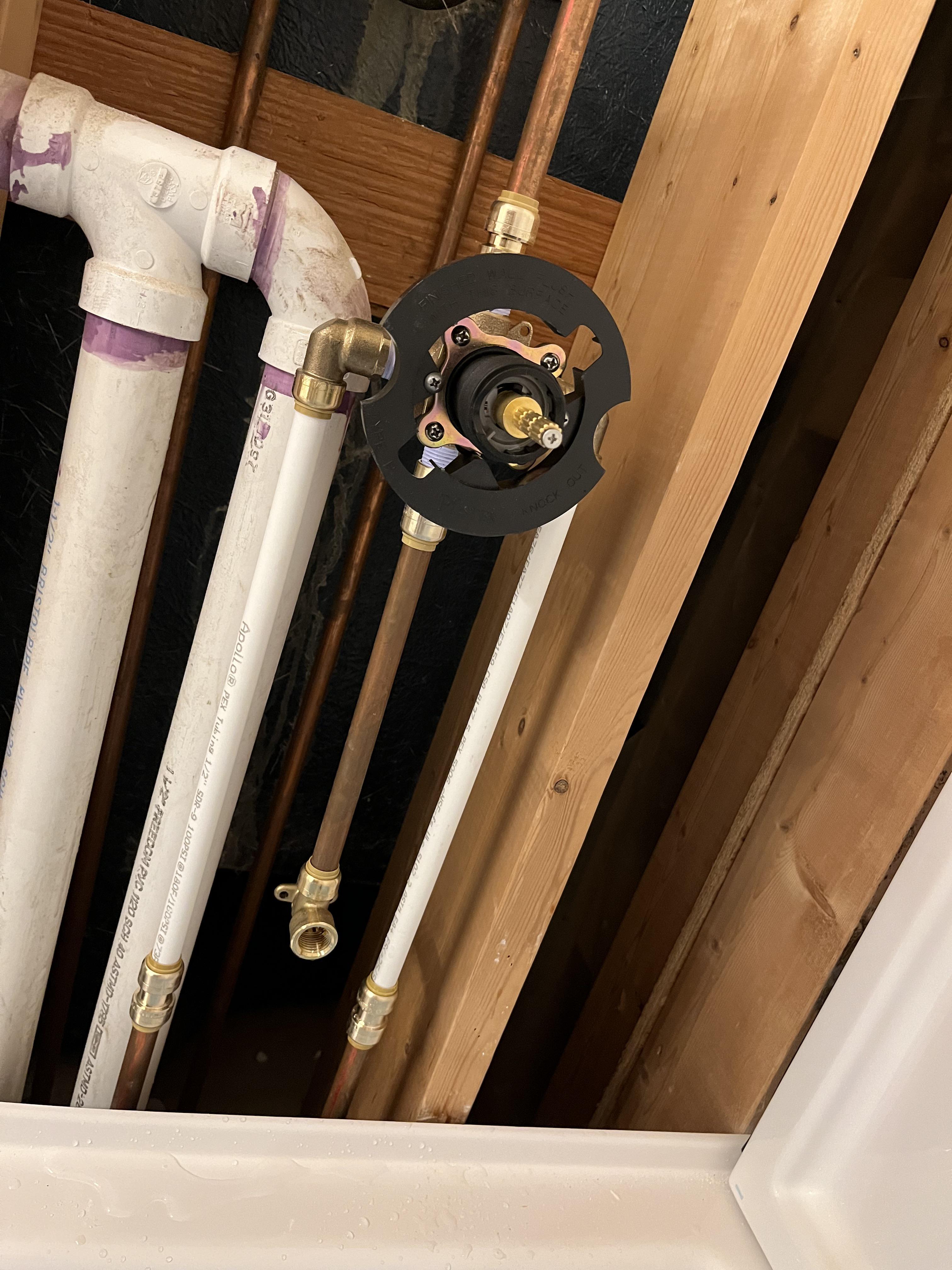 New tub/surround, plumber had to changing some piping Plumbing