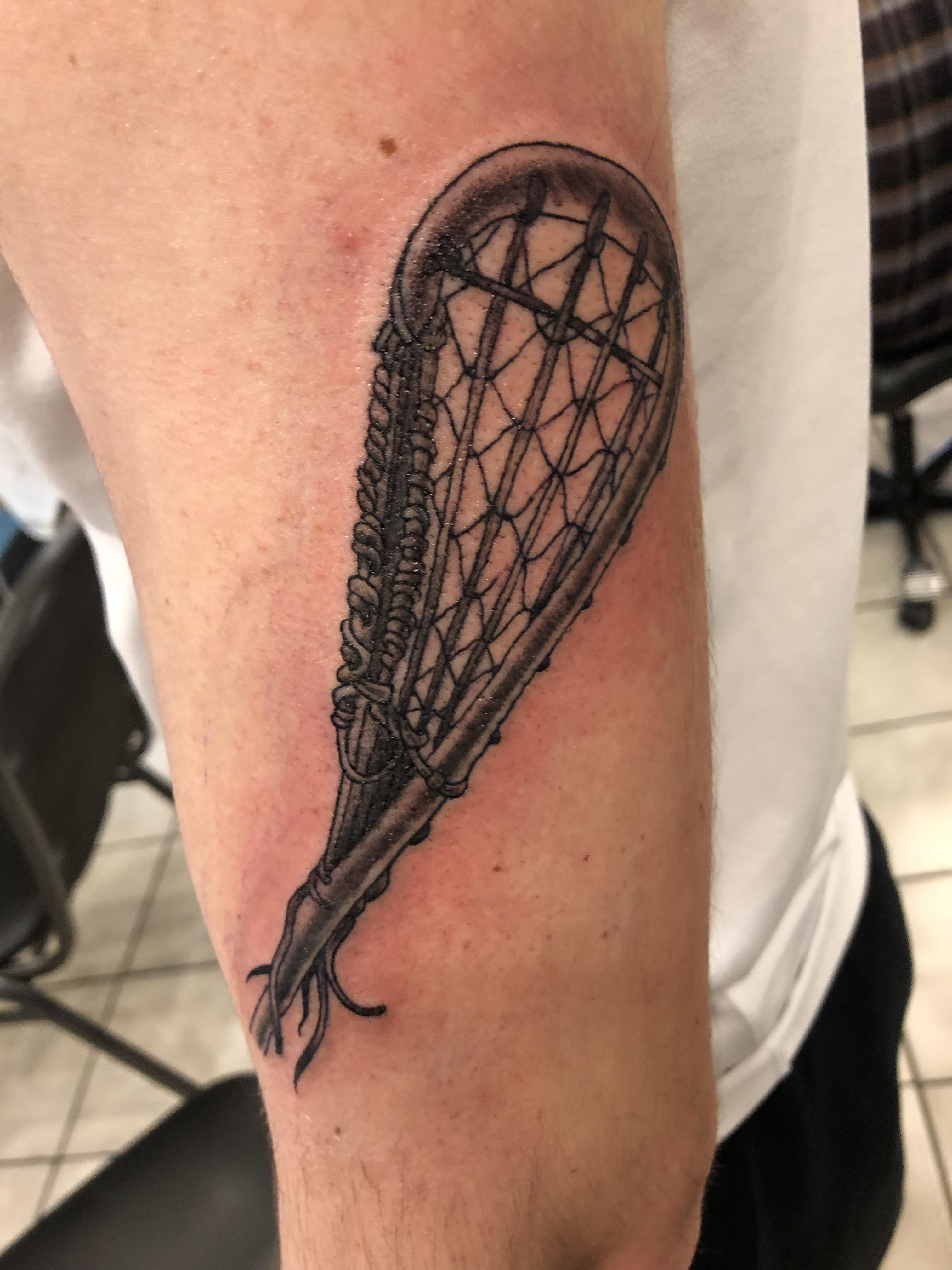 First tattoo! 1800s era Native American lacrosse stick done by Lorne