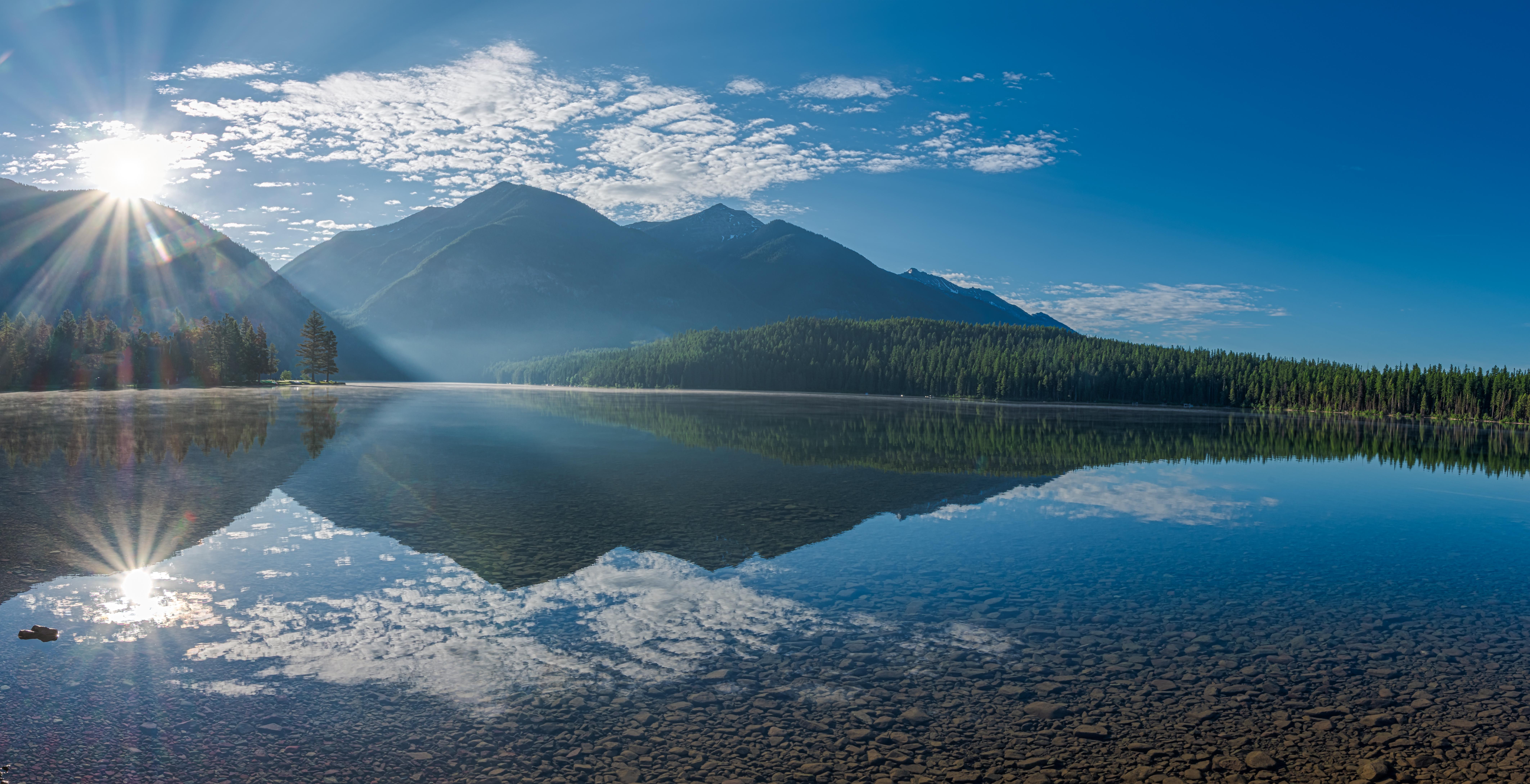 Sunrise on Holland Lake, Montana [8500×4357] [OC] r/Montana