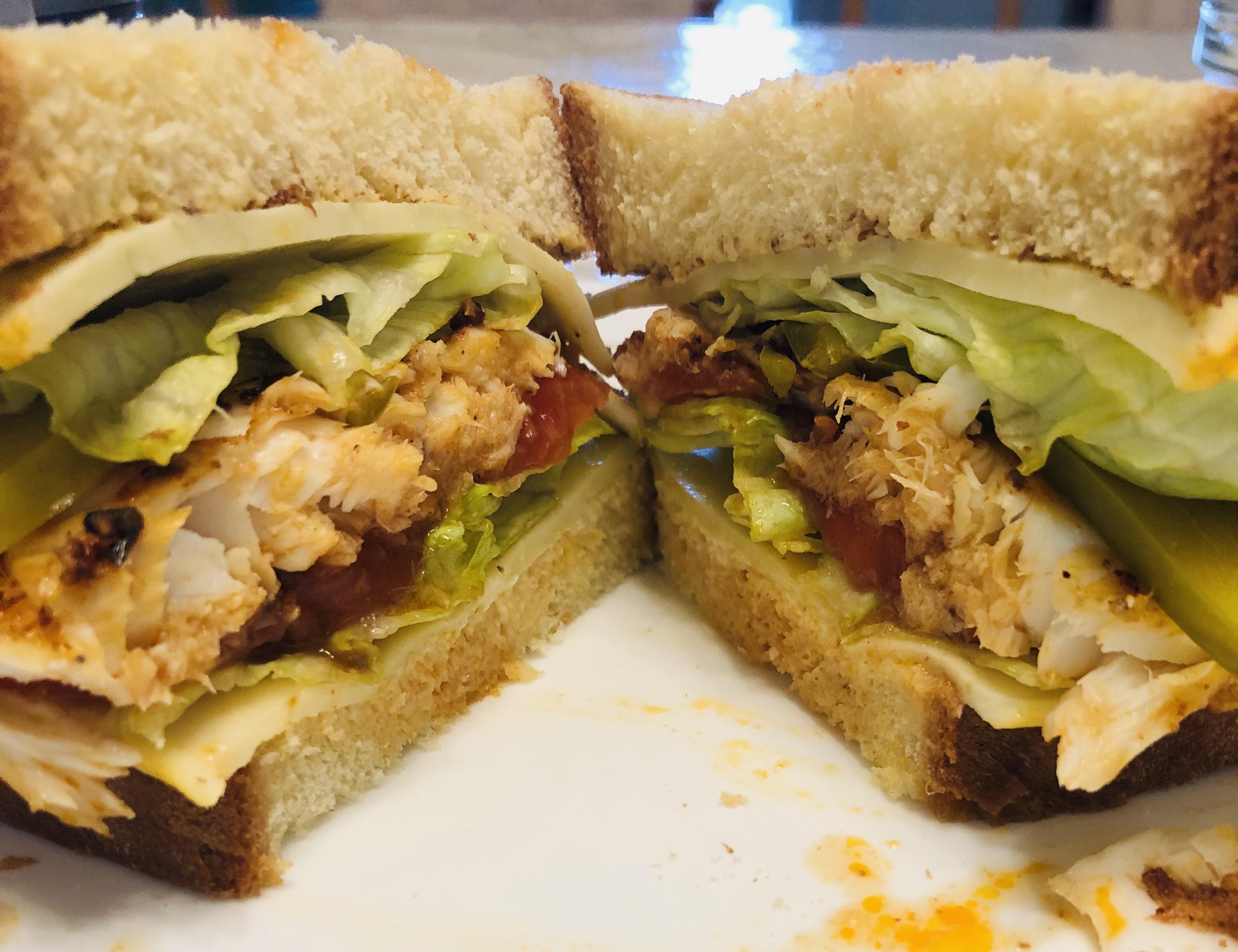 Blackened tilapia sandwich for lunch. Filling and delicious 🐟 r