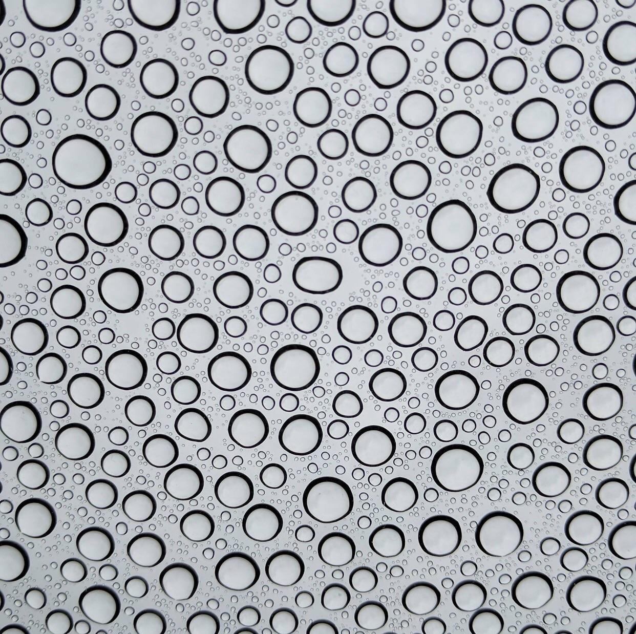 The way the water beaded onto my cars sunroof (taken from inside