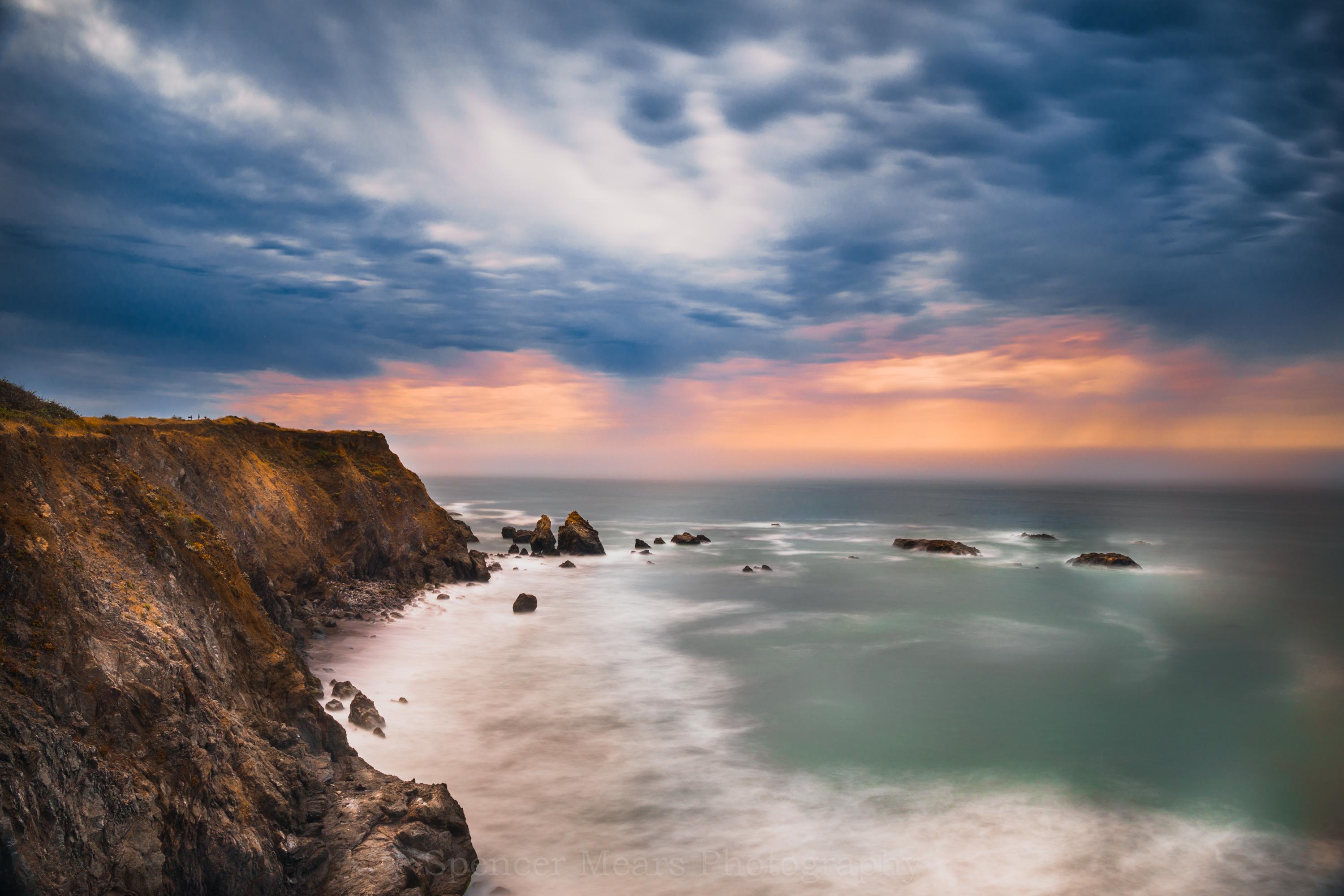 Cliffside view of the stormy Northern California Coast at sunset Mendocino CA USA [OC