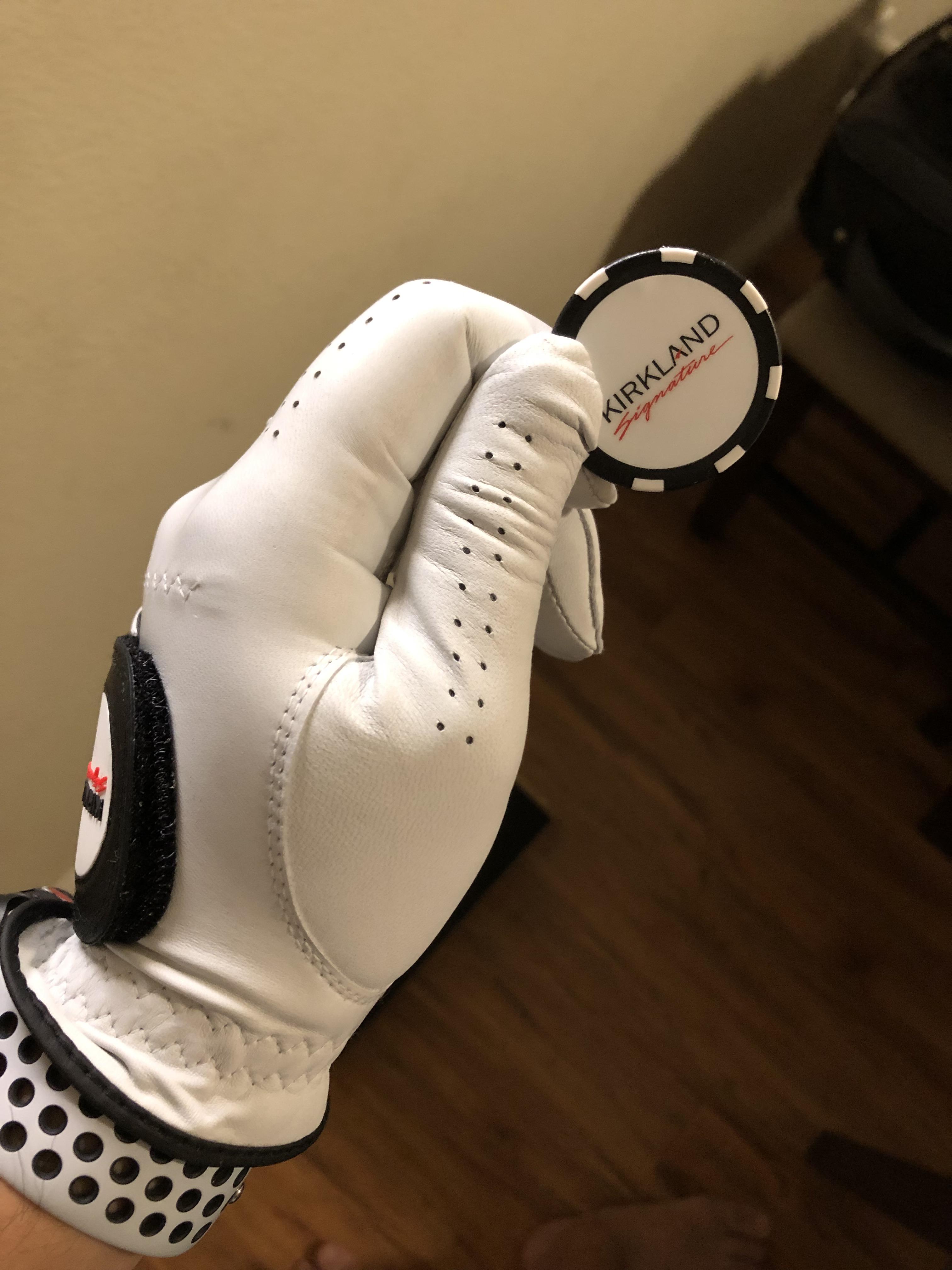 The ball marker comes with the golf glove (15 for 3) from Costco is a