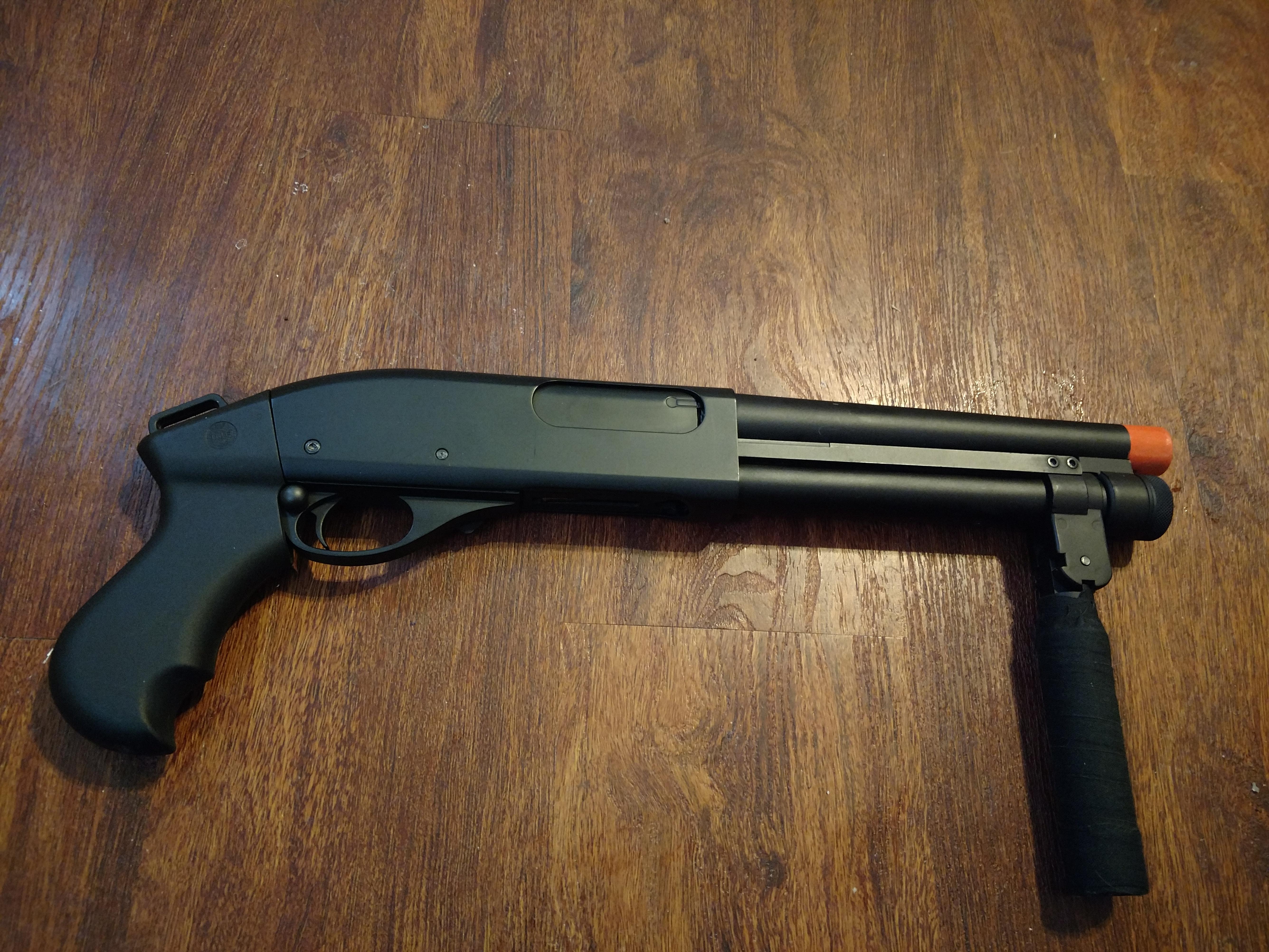 Golden Eagle Serbu 870 with extended foregrip and real