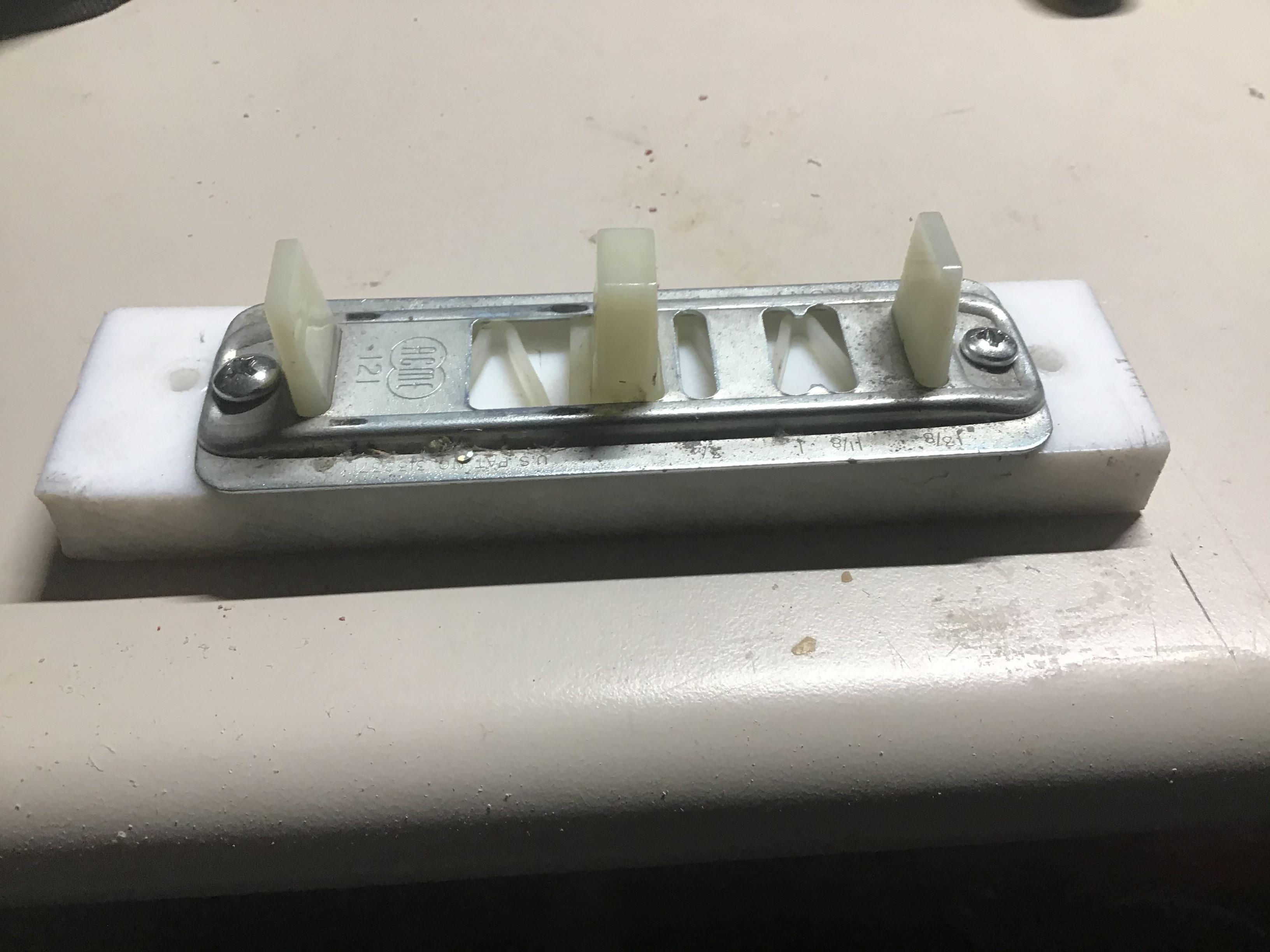 Closet door floor guide. This needs to be anchored to a floating floor