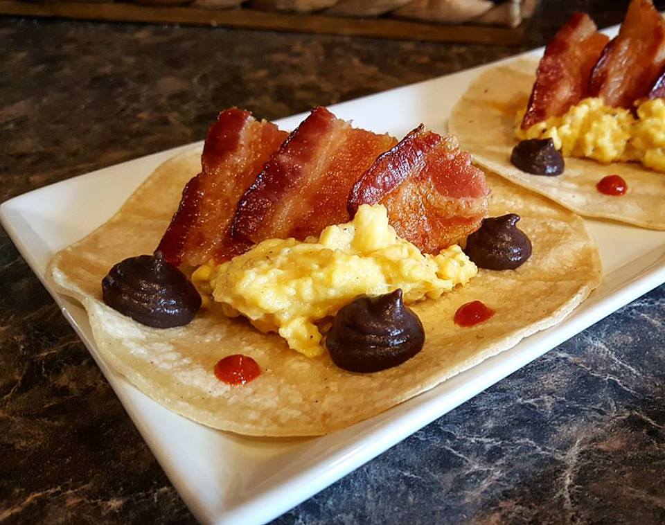 Breakfast Tacos Scrambled eggs, Applewood Smoked Bacon, Cheddar Cheese, Black bean puree
