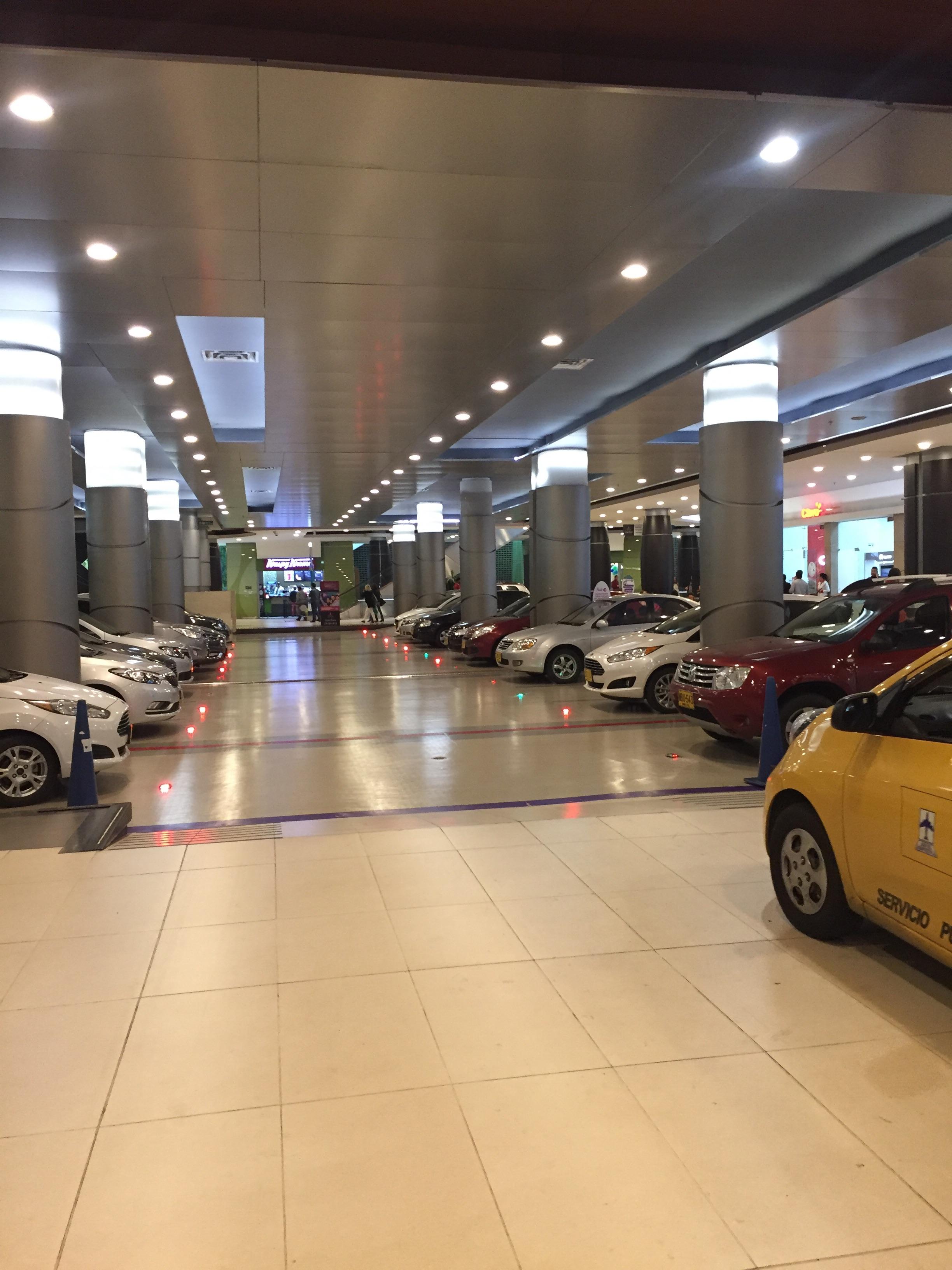 This mall has a parking lot inside of it along with the stores. r