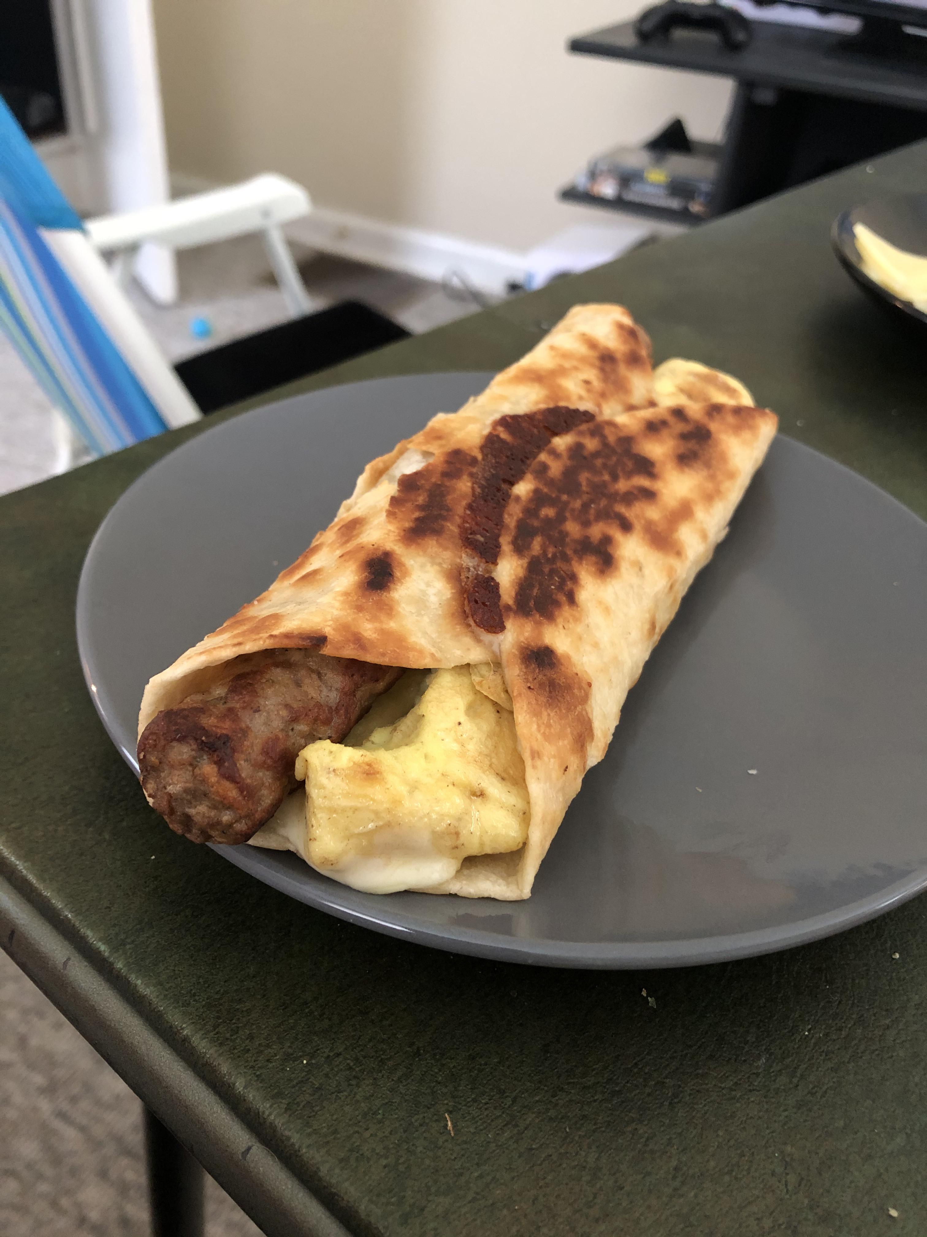 Egg and sausage link burrito with provolone. It was divine. r