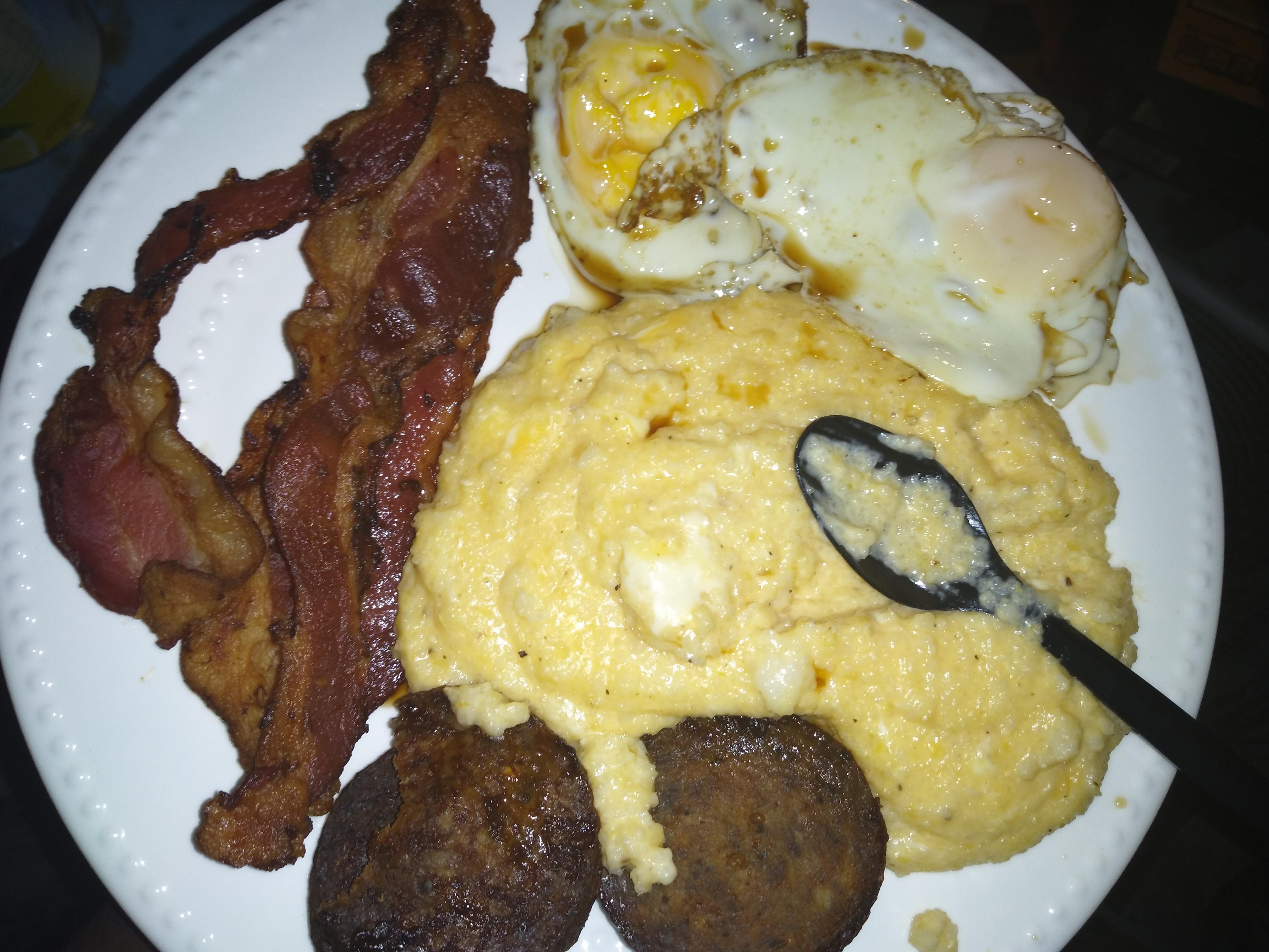 Breakfast for dinner; cheesy grits, spicy breakfast sausage, bacon and