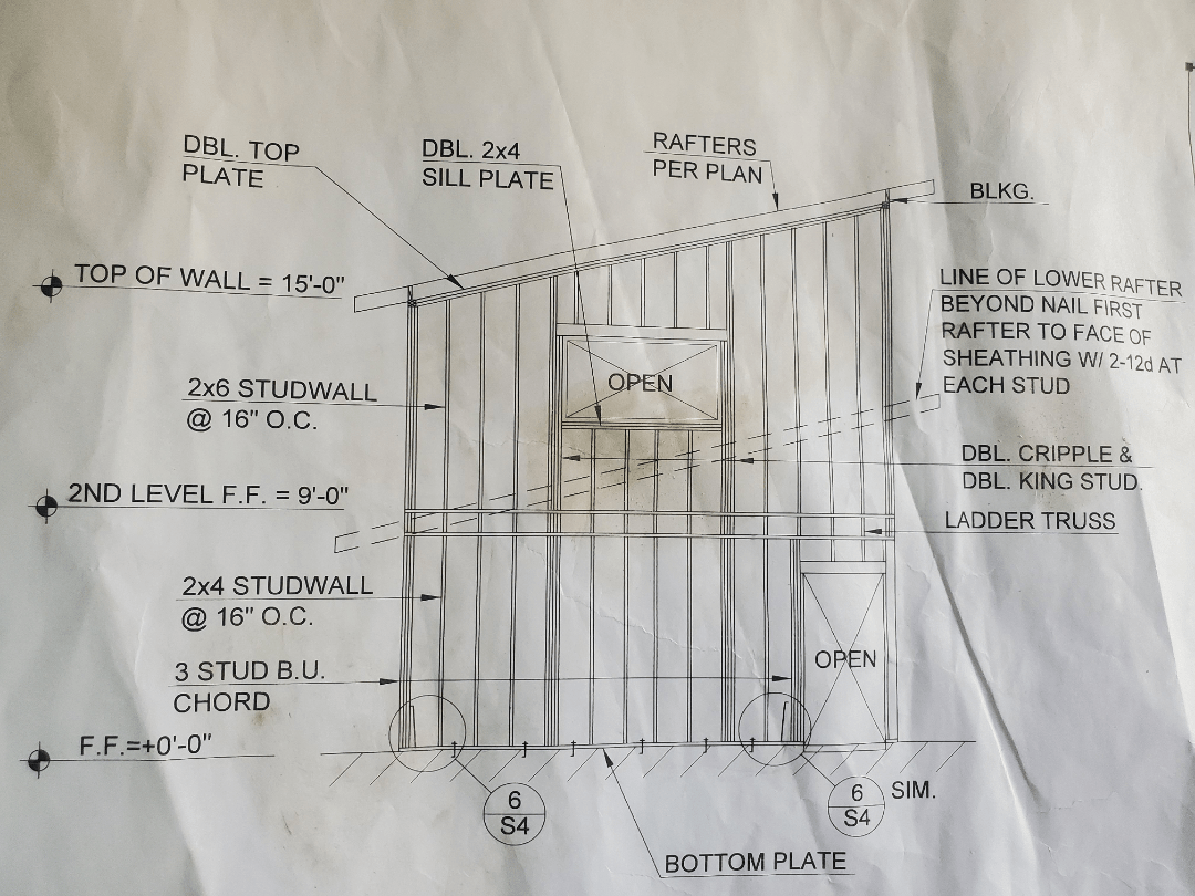 What is the structural benefit of 2x4 studs at the bottom story and 2x6