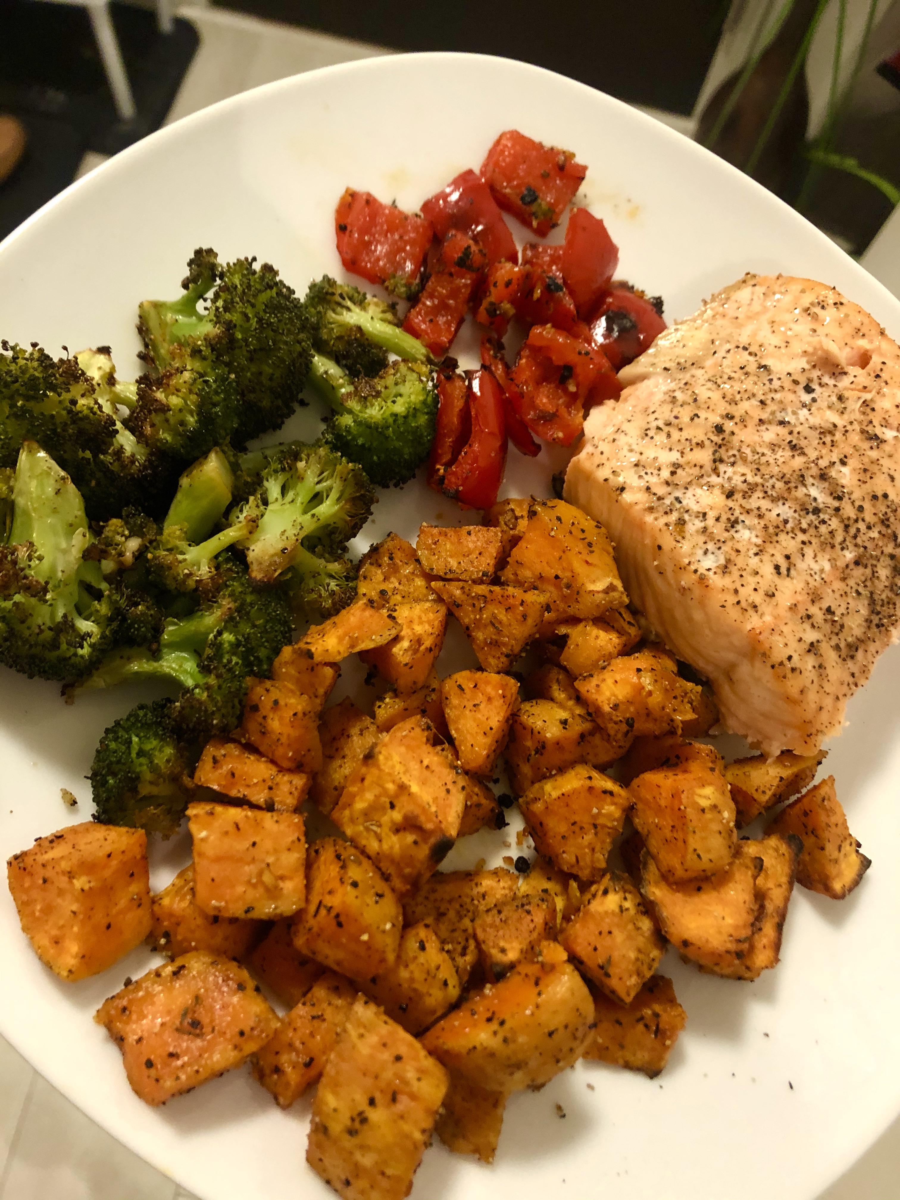 Oven baked salmon with roasted sweet potatoes, garlic broccoli, & red