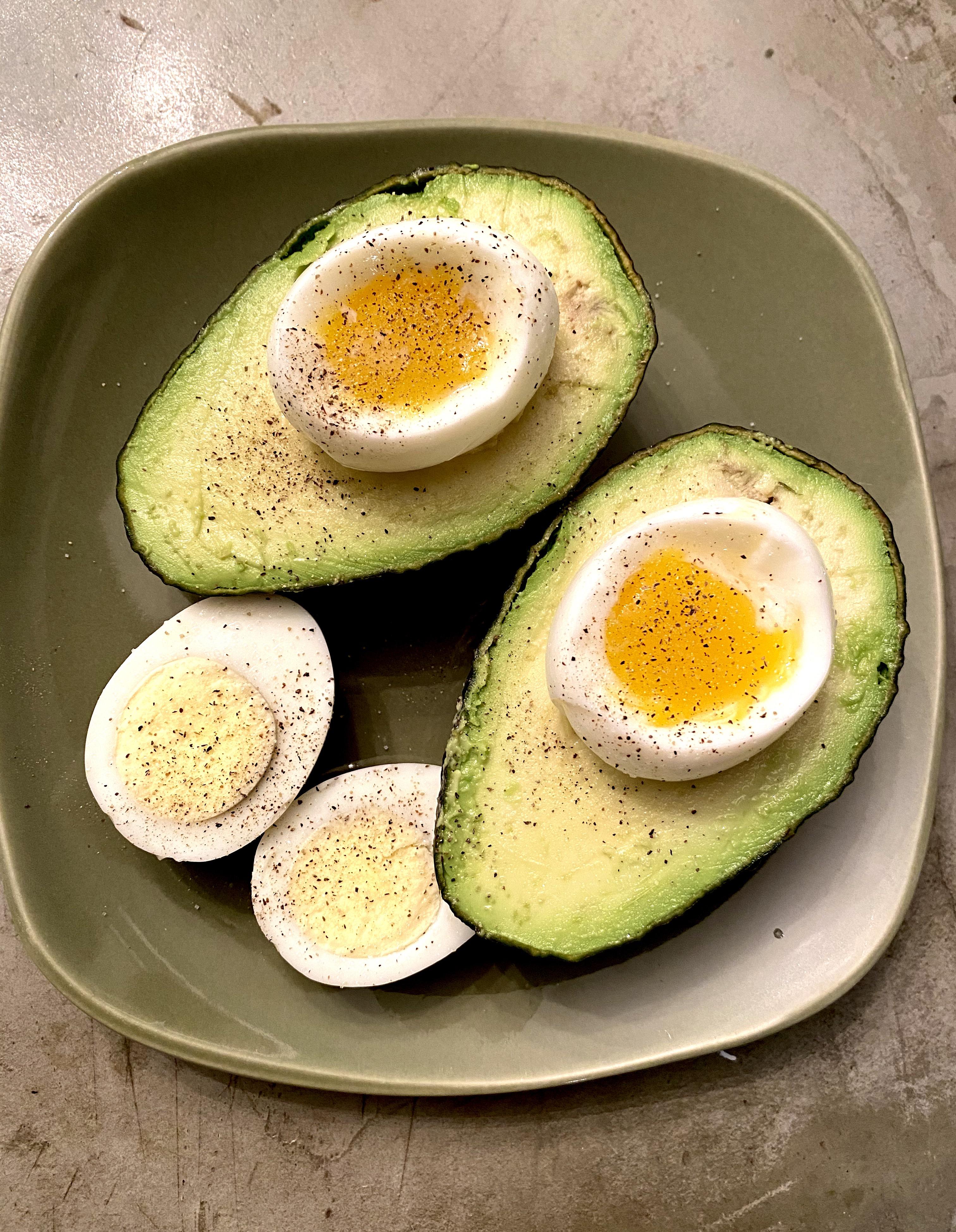 [OC] Simple breakfast. Boiled eggs with fresh avocado r/FoodPorn