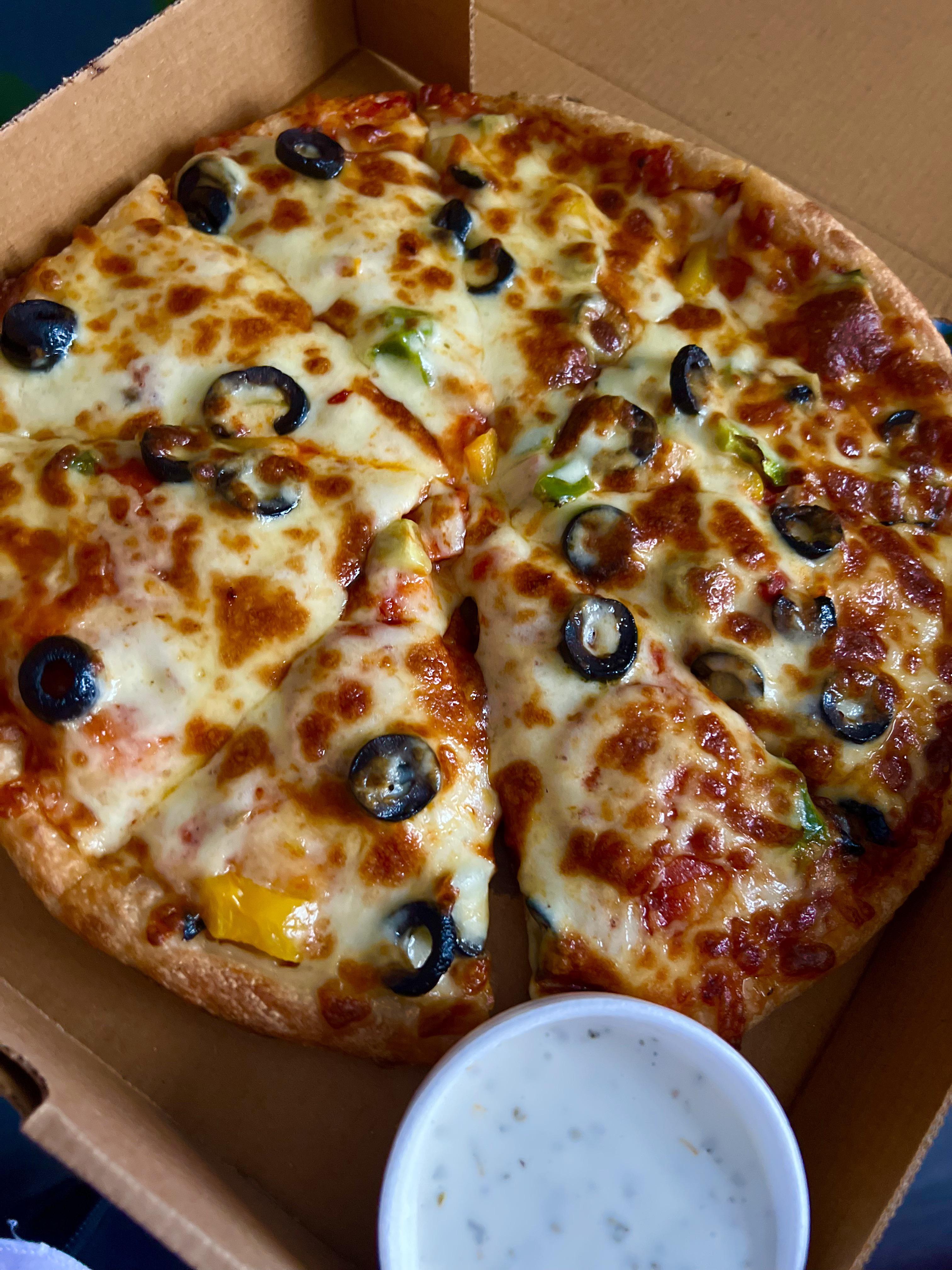 [i ate] Takeaway pizza. Pepperoni, black olives, peppers, extra cheese