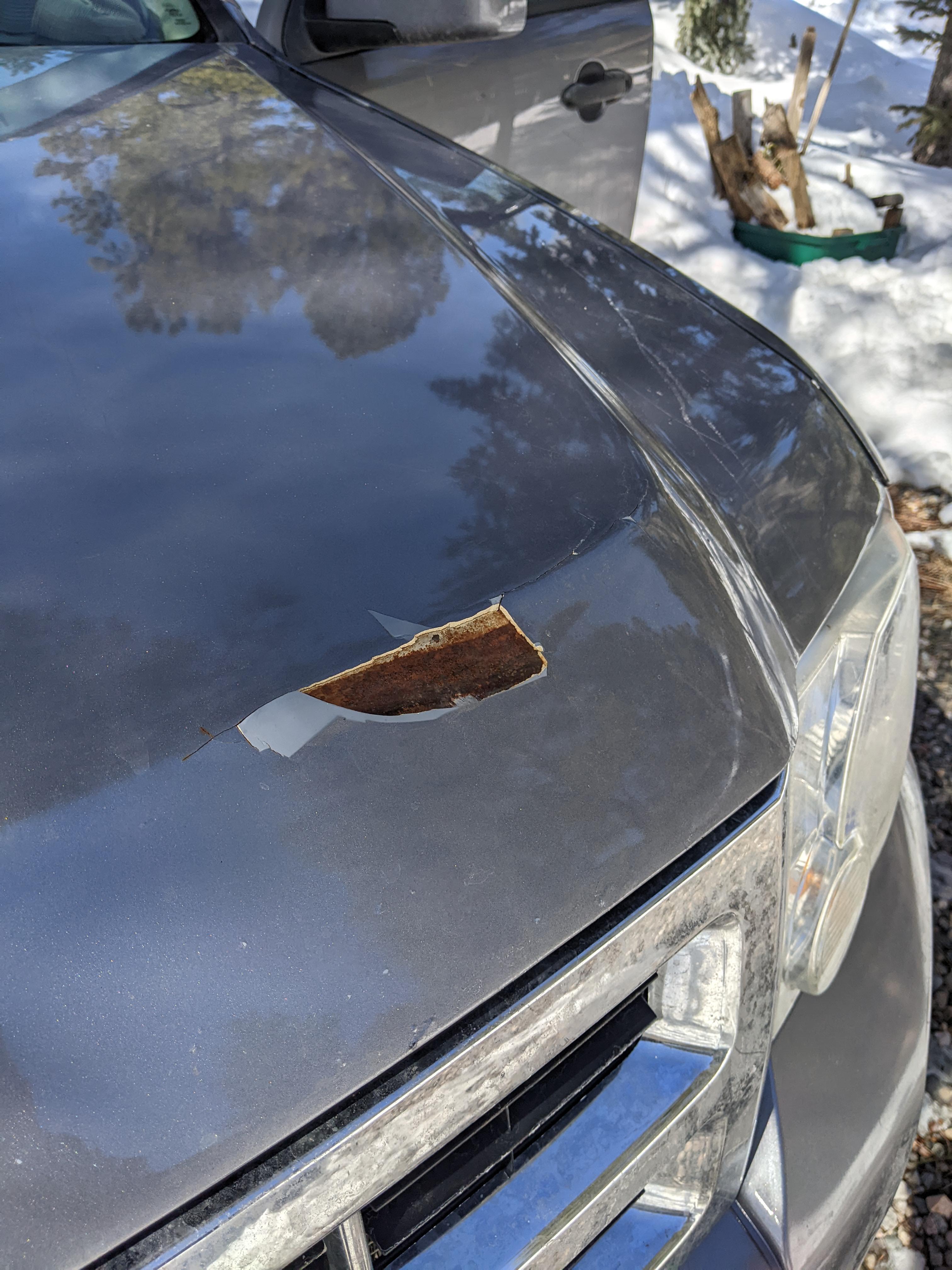 How to repair this damage on the hood of my car? It chipped away when I was clearing snow