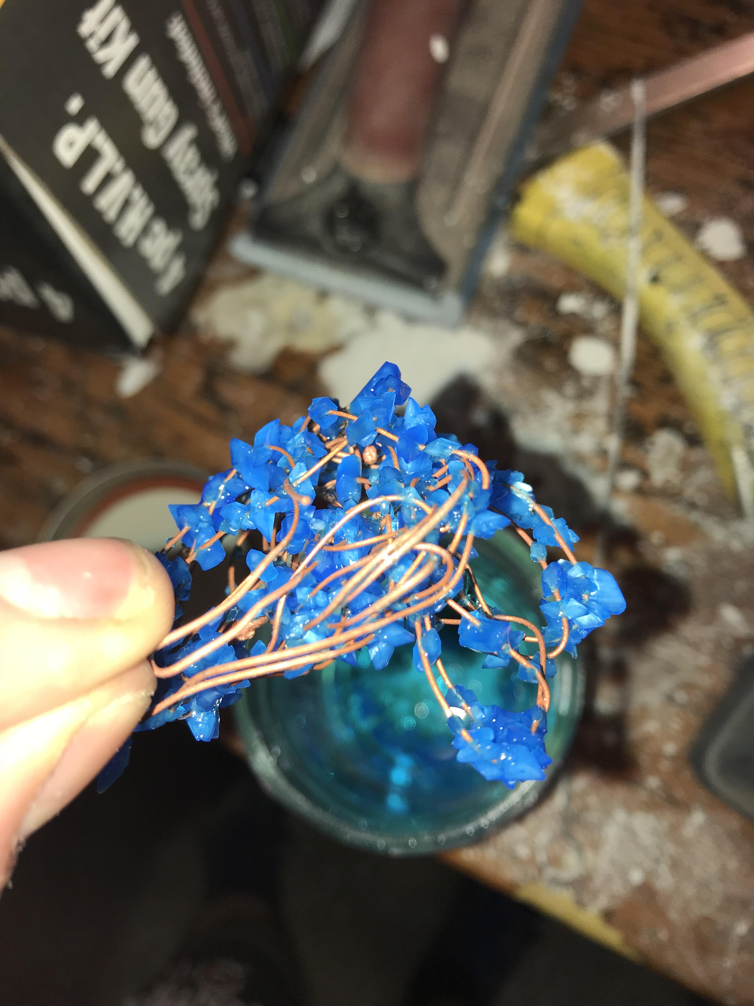 Copper(II) Sulfate crystals I grew on copper wire, in a solution of