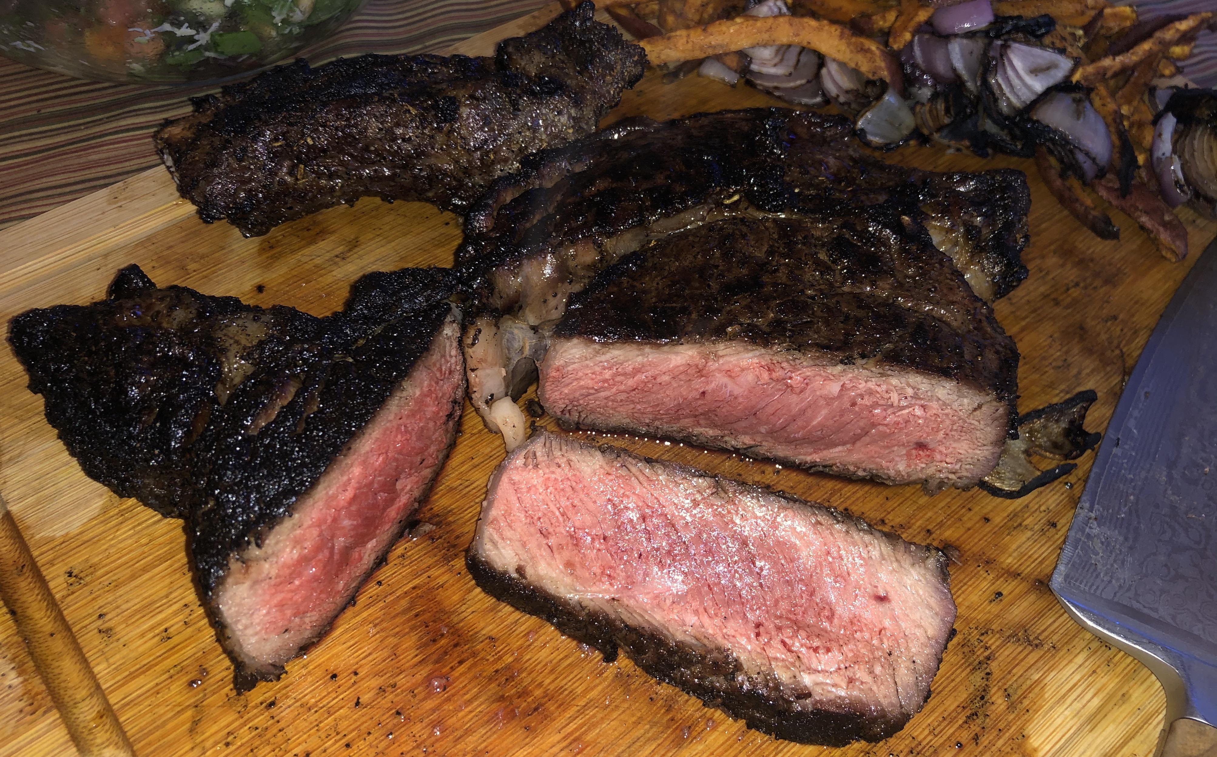 Charred Ribeye in fireplace over cherry wood r/steak
