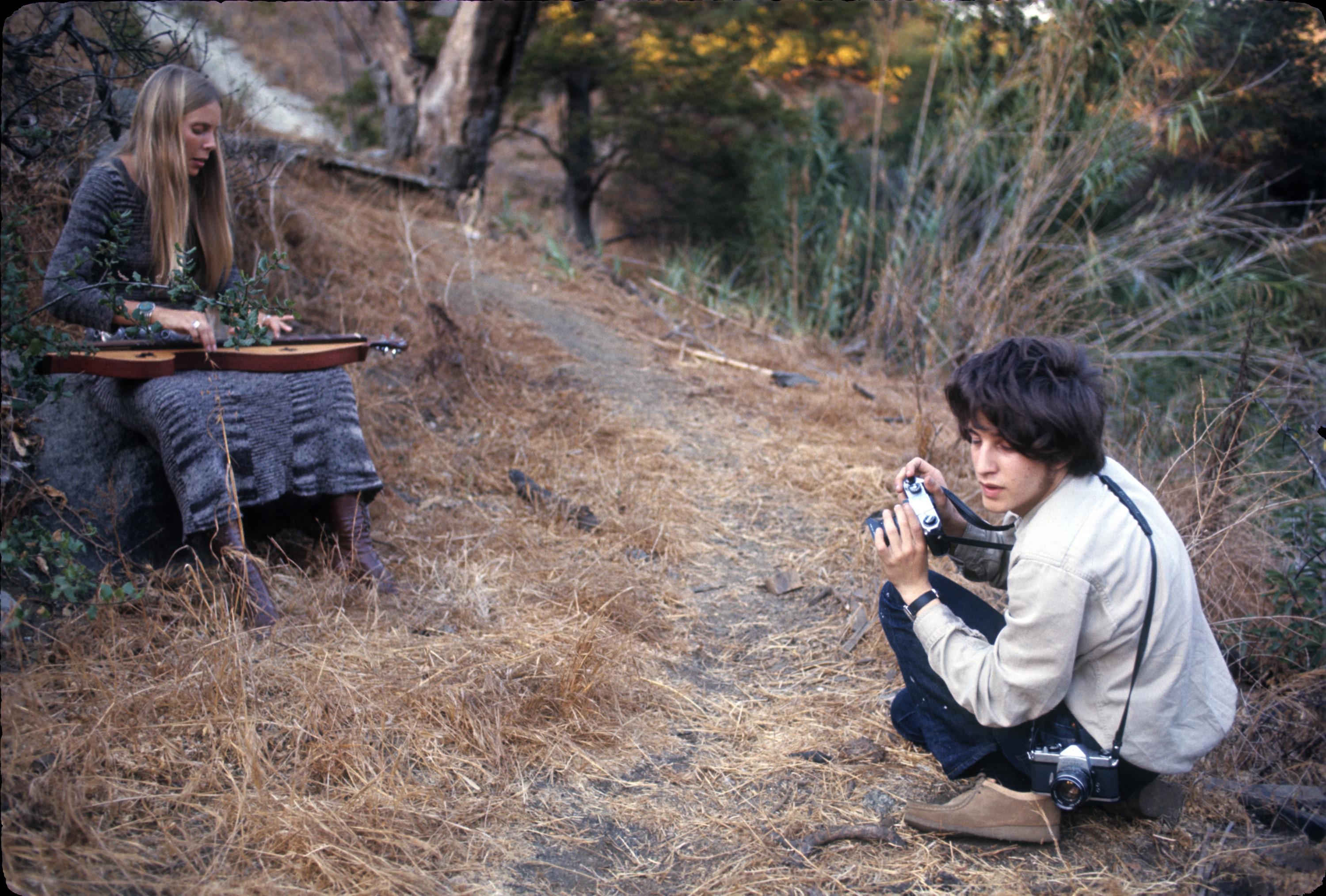 Joni Mitchell playing her dulcimer, with Joel Bernstein nearby. Laurel