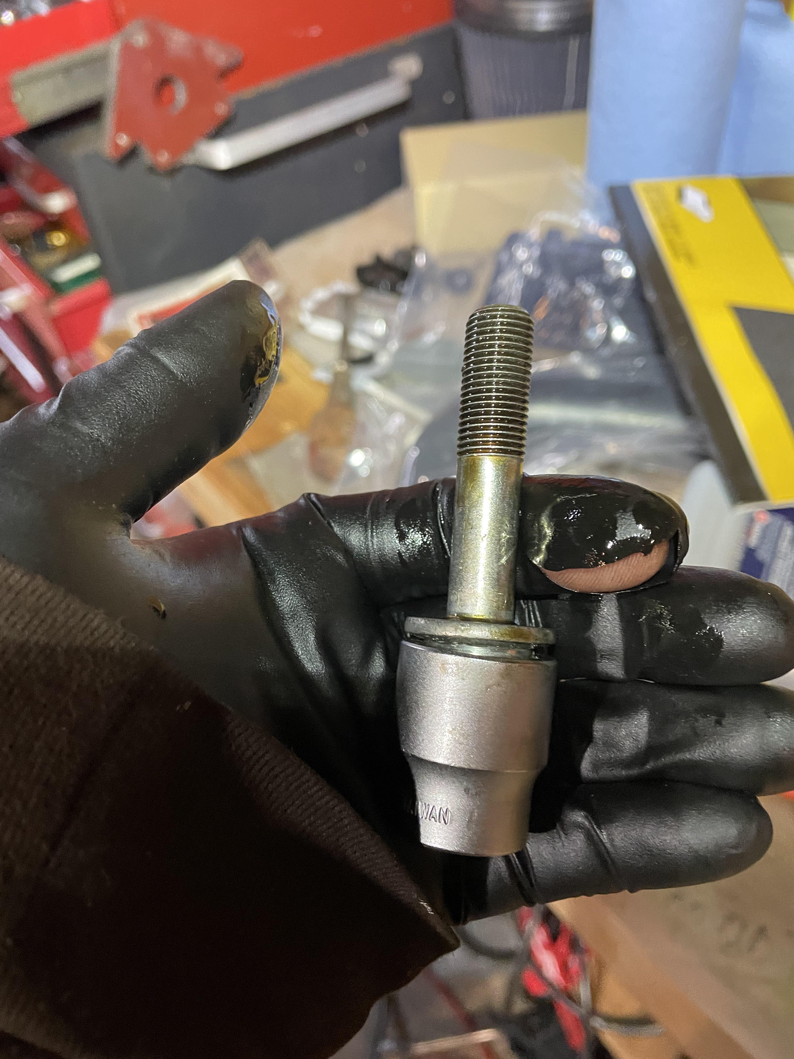 Got it! Pulled the rounded cam bolt out with an 11/16 bolt extractor