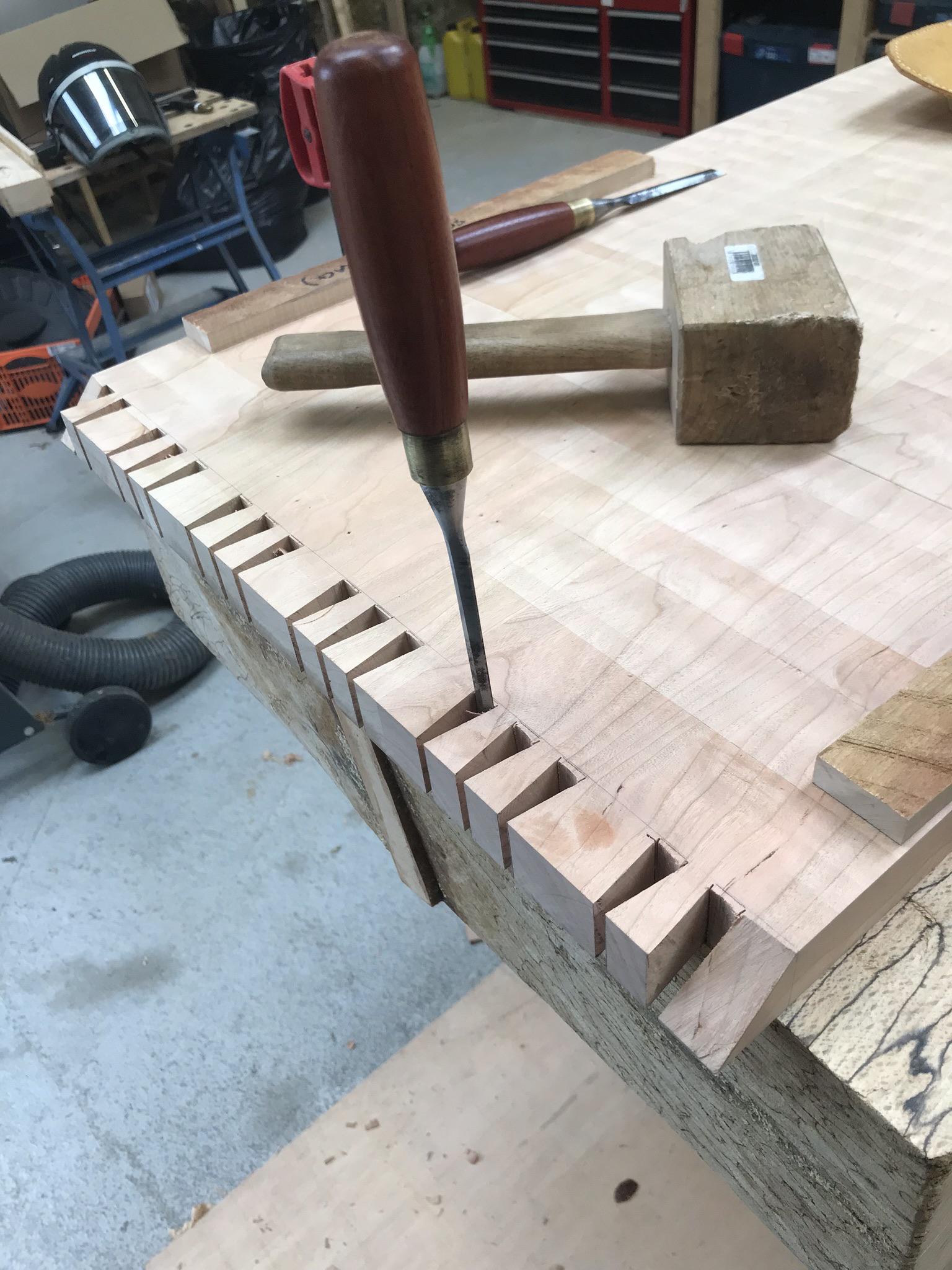 17 dovetails, hard to fit together to test. My tail saw cuts are decent