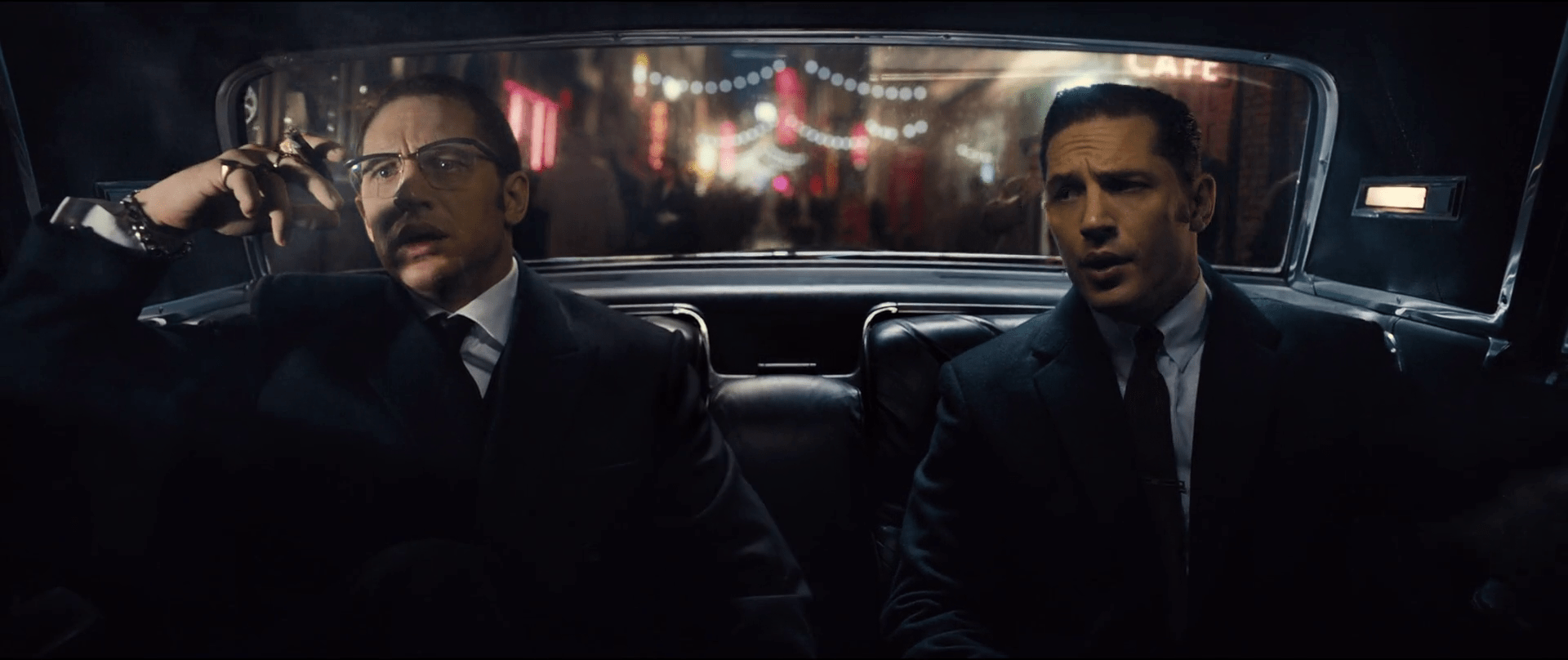 Watching Tom Hardy playing double role of 60s London's mafia twins with an uncanny Cockney