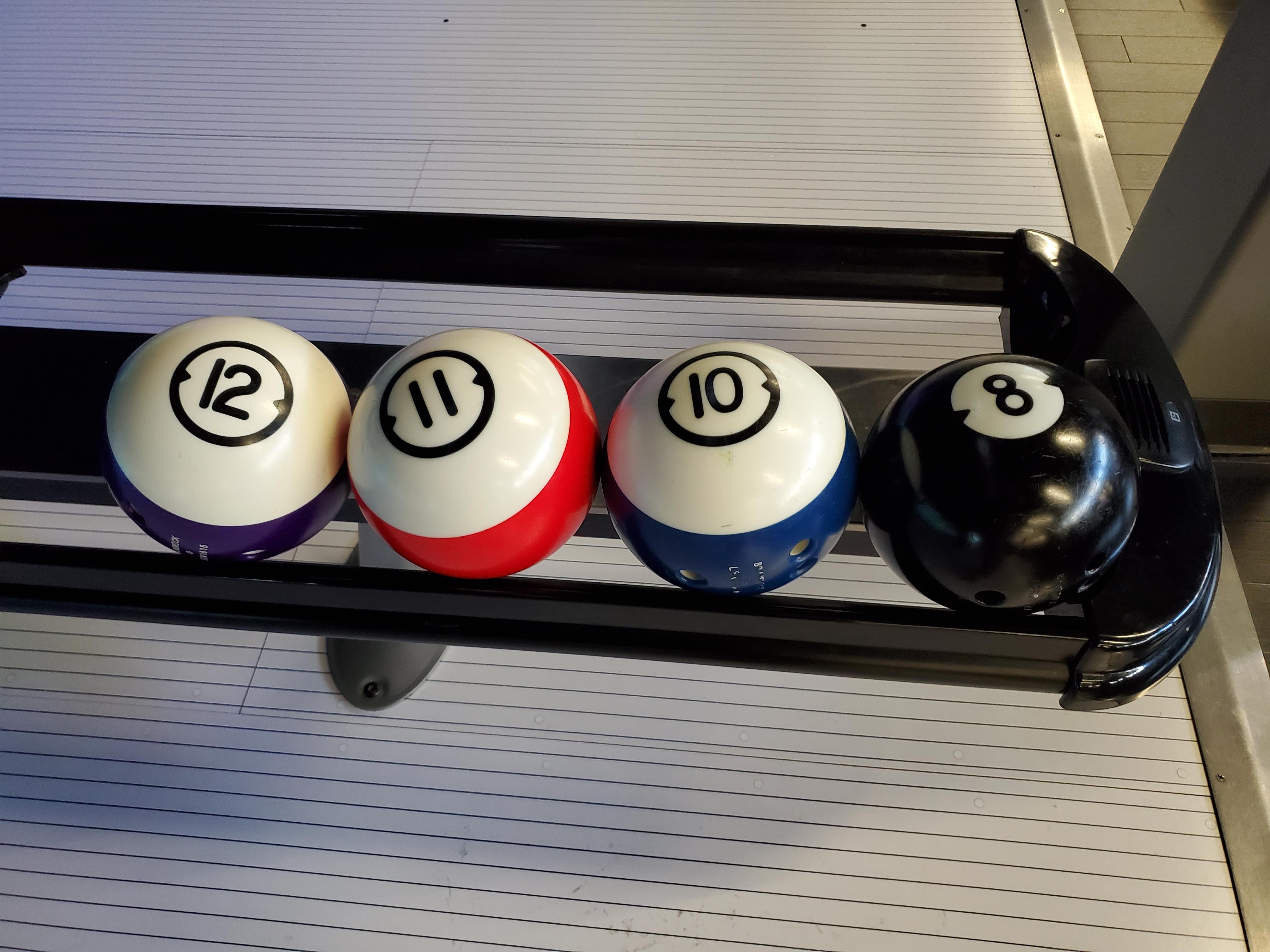 The balls at this bowling alley are designed to look like billiard