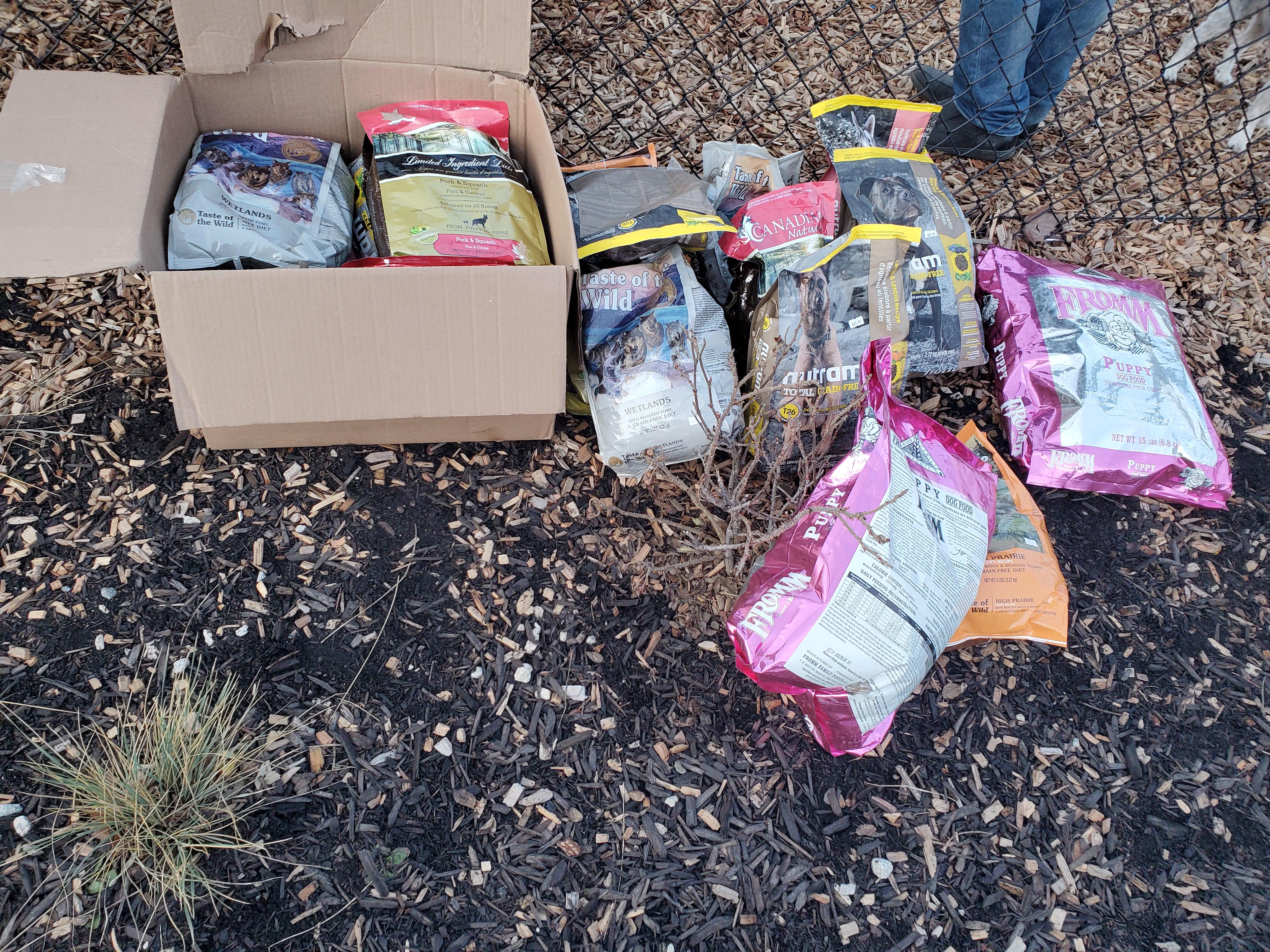 Bags of unopened dog food dumped outside of Rowcliffe park. Lots of